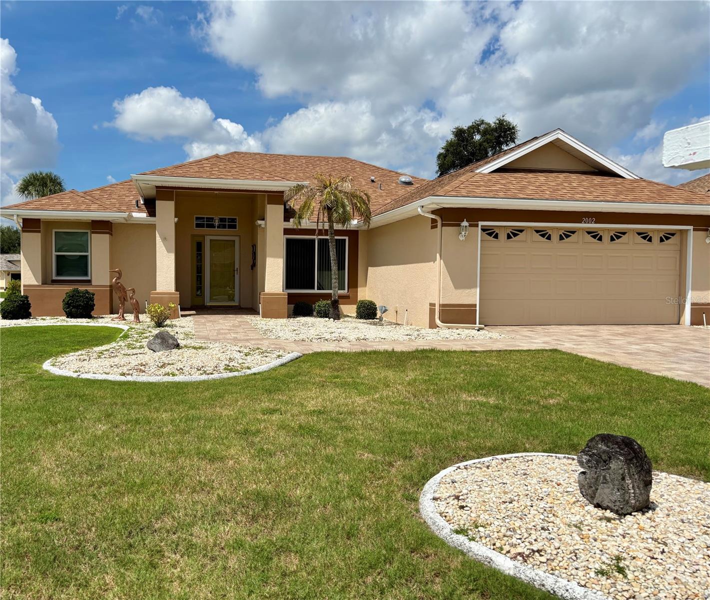 Be among the first to see this move-in ready expanded Kingston model home in the favorite Caloosa neighborhood of Sun City Center. The elegant curb appeal with extensive block paver driveway invites you into the living/dining area with vaulted ceilings and entrance to the family room. This immaculate home includes a kitchen with modern cabinetry, eat-in area with bay window and a handy desk and pantry. The reversed osmosis system provides you with pure drinking water. Check out the master bedroom with two walk-in closets and a master bath with updated dual sinks, private commode, gorgeous shower, garden tub, and spacious linen closet. The split plan includes a bedroom with an extra deep closet and lovely guest bathroom. The added bonus is the Florida Room with sliding doors from the kitchen and guest room (not under air and adds 252 sq. ft. to size). Hurricane impact windows have been added throughout the home and the sellers boast of the fabulous sunset views from the back windows. You will love the laundry room with washer/dryer included as well as a sink, cabinets and closet. The two-car garage has storage and pull-down steps to the attic for more storage. There are gutters around the home and an irrigation system throughout the vast corner lot which includes a large side and backyard area. This outstanding friendly golf cart community presents over 200 clubs and activities including a huge fitness center, several pools, a sports complex with pickle ball, volleyball, tennis, softball and more. There is also a dog park, and you can enjoy some delicious meals in our café at poolside. Sun City Center is located between Tampa and Sarasota where you will find three international airports. Tampa is a gateway to three major league sports team events, theme parks and beautiful popular beaches on the gulf coast. Come be a part of Sun City Center voted “Number 1 retirement community by Travel and Leisure Magazine” in 2024.