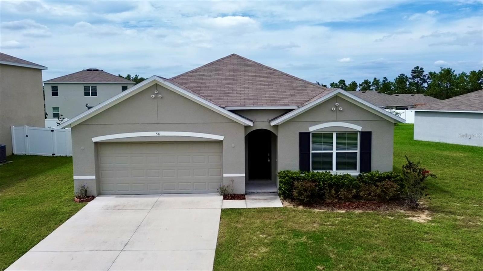 Welcome to this beautiful concrete block house in Lake Diamond, a renowned gated subdivision with a golf course in Southwest Ocala, near big stores, such as Publix, Aldi, and Walmart.
This spacious house features 4 bedrooms and 2 bathrooms within 1,828 square feet under air conditioning, and a car garage for two vehicles. The kitchen has impressive granite countertops, large pantry, stainless-steel range, microwave, built-in dishwasher, and refrigerator. The ensuite primary bathroom has double vanity and two walk-in closets. There is an irrigation system. The inside laundry room has washer and dryer.