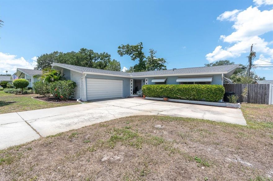 This spacious 3-bedroom, 2-bath home with a bonus room offers flexible living space with room to spread out. The oversized living room connects seamlessly to the dining room, creating an inviting layout for everyday living and entertaining. The large kitchen features sleek stainless steel appliances, abundant cabinetry, a pantry, and plenty of space, The laundry room is conveniently located off the kitchen and includes a utility sink.
One bedroom features a mini-split system for personalized comfort, while a solar attic fan helps improve energy efficiency. Terrazzo floors remain beneath the carpeting, offering future possibilities. The home is also wired for an exterior gas generator.
The primary suite includes a walk-in closet and private bath with a walk-in shower. Hurricane windows protect the rear of the home, and major updates include a roof (2023), A/C (2022), updated electrical panel, and water heater (2016). A permitted addition and renovation completed in 2015 added valuable square footage and enhanced functionality.
Outside, enjoy a peaceful backyard featuring a pond, fire pit, mature trees, sprinkler system supplied by a well, kayak racks, storage building, and fencing installed in 2018. The oversized driveway was expanded with concrete in 2019 and complements the two-car garage, providing ample parking and storage.
This well-maintained home offers generous living space, thoughtful updates, and inviting outdoor amenities ready to enjoy.
Located in a beautiful neighborhood. Come see it today.