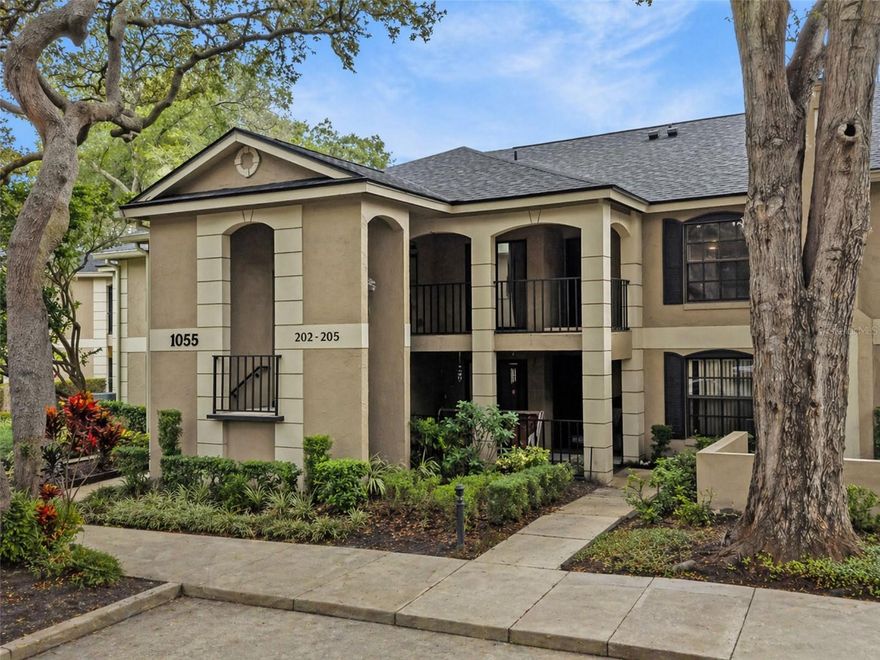 One or more photo(s) has been virtually staged. Welcome to this beautifully remodeled 2-bedroom, 2-bath condo offering a spacious and airy open-concept design. Natural light pours in through three large sliding glass doors, creating a bright and inviting atmosphere throughout. Light oak LVP flooring enhances the home with both style and durability, perfectly suited for everyday living.

The kitchen is a true centerpiece, featuring expansive quartz countertops that extend seamlessly into the backsplash, a sleek modern range hood, pot filler over the range, stainless steel appliances, and a fashionable statement faucet. Designed for both function and style, the kitchen also opens to a charming front sitting area—perfect for casual dining or morning coffee.

Enjoy exceptional indoor-outdoor living with multiple outdoor spaces ideal for relaxing or entertaining. The oversized screened-in back lanai overlooks the pool and is surrounded by mature live oaks, providing shade and a tranquil setting.

The primary suite features a generous walk-in closet with abundant storage, a dedicated vanity area, and a beautifully updated ensuite bath. Both the ensuite and guest bathrooms showcase modern upgraded fixtures, stylish lighting, and warm neutral tile finishes.

Additional highlights include designer lighting throughout, a brand-new in-unit washer and dryer for added convenience, a dedicated, assigned covered parking space, and the ease of true low-maintenance living. The HOA includes cable, internet, water, and trash for added convenience.

Located within a gated community, residents enjoy access to resort-style amenities including two pools, a hot tub, sauna, clubhouse, fitness center, gym, tennis courts, and pickleball. Ideally situated close to shopping, dining, and everyday essentials, this home offers effortless Florida living in a prime location.