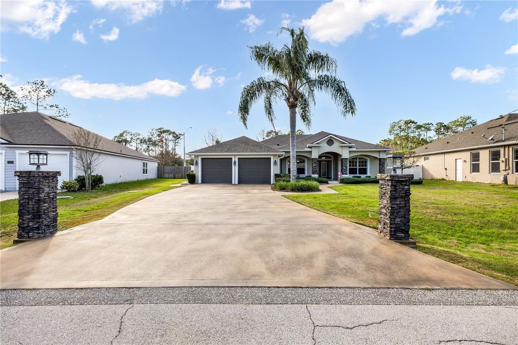 Photo of 24 Point Of Woods Drive, Palm Coast, FL 32164 (MLS # FC315096)