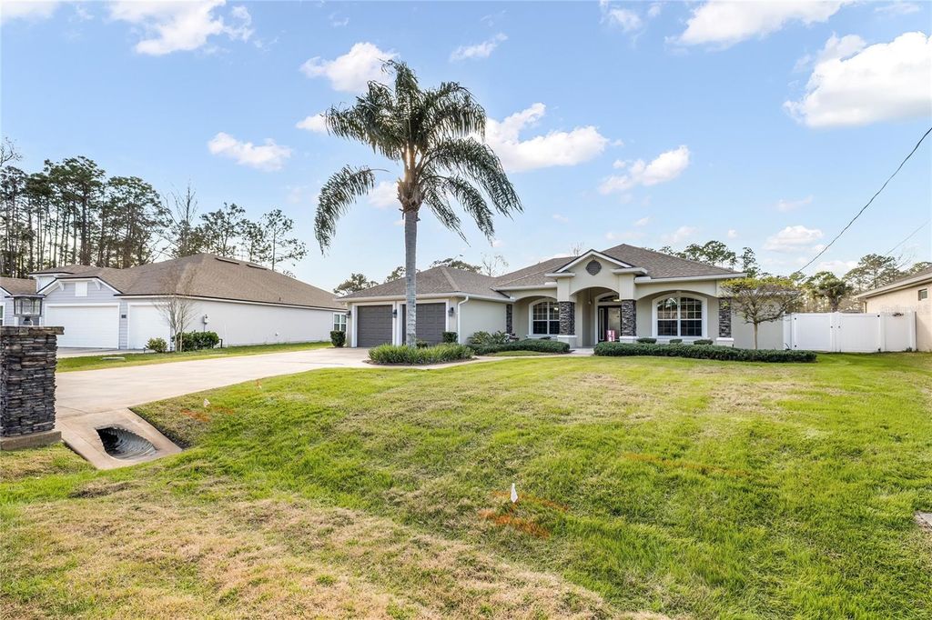 Photo of 24 Point Of Woods Drive, Palm Coast, FL 32164 (MLS # FC315096)
