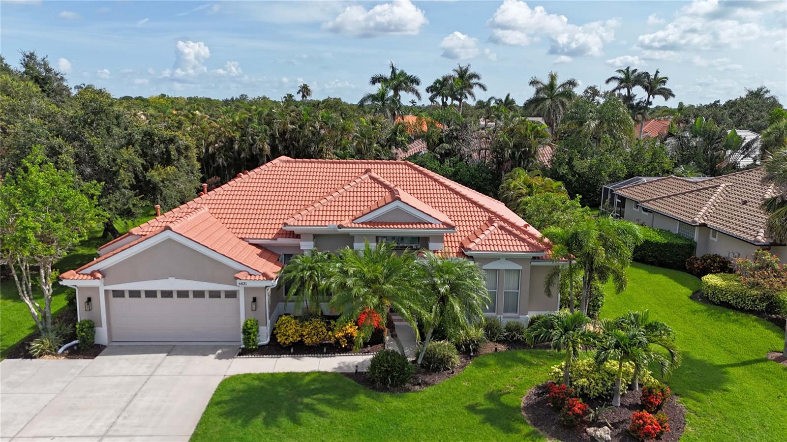 Under contract-accepting backup offers. "Move-In Ready" Just Reached a Whole New Level! Welcome to this immaculate 4-BEDROOM + OFFICE/DEN + 3 FULL BATHS , ideally located behind the gates of the beautifully maintained Turtle Rock community—renowned for its scenic walking trails, mature landscaping, and picturesque natural vistas. This stunning residence offers true peace of mind and modern comfort with a brand new roof $52,736.00(2024) Thoughtful upgrades enhance both the aesthetics and functionality of this beautifully designed built home by renown builder Todd Johnston. Step inside to a spacious, light-filled interior adorned with luxury vinyl flooring throughout, elegant 5-inch baseboards, crown moldings, tray ceilings, and a fresh designer color palette inside and out. The updated kitchen is a chef's dream, featuring granite countertops and backsplash, premium KitchenAid stainless steel appliances including a natural gas range ( Turtle Rock is a natural gas community) with convection oven, built-in microwave, three-door counter-depth refrigerator, and dishwasher. Raised-panel wood cabinetry with soft-close hinges and sleek modern hardware enhance the kitchen, laundry room, hall, and guest bath. Storage has been reimagined with custom wood organizers in the walk-in pantry and closets. All lighting has been updated to energy-efficient LED fixtures, including stylish pendant lights and upgraded ceiling fans. Each bathroom showcases contemporary quartz countertops, updated fixtures, and framed mirrors. For added consistency, all door hardware and hinges have been replaced for a seamless updated look throughout. A pair of double leaded-glass front doors offers a grand and elegant entry. The home has been completely re pipped and features a natural gas water heater and gas furnace integrated with the air handler for efficient climate control Lennox AC system $ 16,320.00.(2023) . Step outside to the oversized screened-in pool area, complete with an expansive lanai and two covered verandas—one of which is pre-plumbed for a future outdoor kitchen. The 2-car garage is equally impressive, offering an epoxy-finished floor, a level 2 electric car charger, generator ready electric breaker system, ceiling mounted storage racks, cabinetry, attic access via pull-down ladder, and even a bike pulley system. An extended 3-car-wide driveway provides generous parking. Curb appeal is enhanced by an updated landscaping package and a reclaimed water irrigation system with timer—conveniently (Reclaimed water is included in the HOA dues). As a Turtle Rock resident, enjoy access to resort-style amenities: a heated community pool, tennis and basketball courts, clubhouse, playground, and miles of scenic trails. All this is just minutes from the Legacy Trail, top-rated schools, Siesta Key Beach, the YMCA, and a wide array of shopping and dining destinations. This truly move-in ready home combines thoughtful upgrades, timeless style, and an exceptional location in one of Sarasota’s most desirable gated communities. Schedule your private showing today before it's too late!