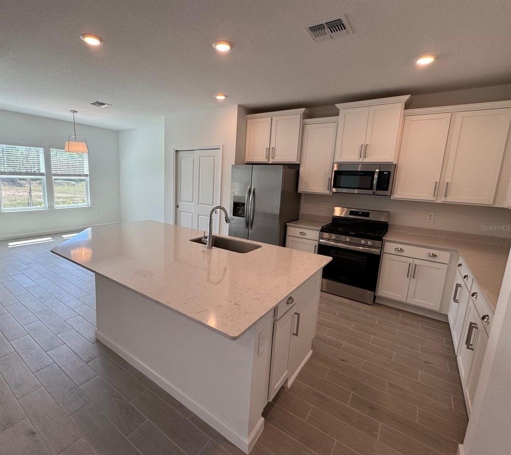 Photo of 13717 NW Convergence Boulevard, Alachua, FL 32615 (MLS # GC539119)