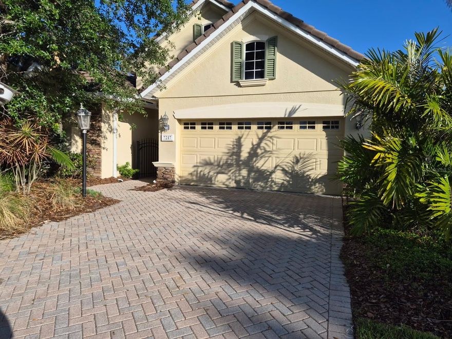 Beautiful home in Lakewood Ranch Country club, Orchid Island Village.   Spacious 2 bedroom 2 bath home with den/library, large lanai and 2 car garage.  No private pool but home is next door to community pool which is very well taken care of.   Large open space perfect for a family to gather and Association fees include mowing the yard for you!   Gated community, Great schools, easy access to Interstate 75 and minutes away from our gorgeous beaches!   Close to any shopping you desire - UTC MALL close by - and too many restaurants to mention!!