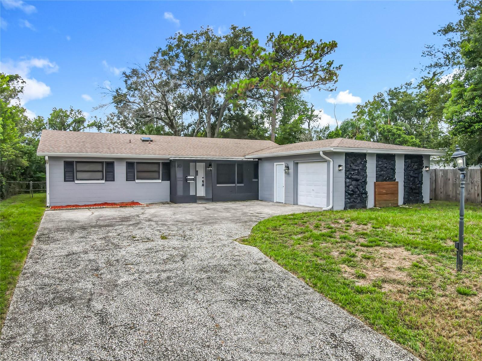 Step into the charm and comfort of this inviting 3-bedroom, 2-bath Winter Park home, where every space is designed to blend functionality with the warmth of Florida living and the freedom of no HOA. From the moment you walk in, you’re greeted by bright and open gathering spaces including a welcoming living room, a cozy breakfast nook, and a spacious dining area that flows seamlessly into the kitchen. The kitchen is a true highlight, featuring a large walk-in pantry for abundant storage and a built-in table nook perfect for getting work done, studying, or creating a small home office. Enjoy the outdoors year-round with two screened living spaces, a charming front porch ideal for morning coffee and an oversized screened lanai that’s perfect for entertaining or relaxing. The fully fenced backyard, shaded by mature trees, offers privacy and a peaceful retreat for gatherings, pets, or simply unwinding after a long day. Recent improvements include a new roof in June 2021, full plumbing replacement in May 2025, and an electrical panel replaced in November 2022. An oversized 420-square-foot one-car garage with a built-in workshop adds plenty of space for storage, hobbies, or projects. Ideally located near Winter Park’s most desirable attractions, you’re just minutes from boutique shopping, fine dining, and cultural experiences along Park Avenue, the scenic Winter Park Chain of Lakes, and Mead Botanical Garden. Winter Park Village offers retail, restaurants, and a movie theater, while Rollins College, local parks, and trails provide year-round recreation. With convenient access to major roadways, commuting to Orlando and surrounding areas is a breeze. This home truly delivers a lifestyle that combines comfort, charm, no HOA, and an unbeatable location.