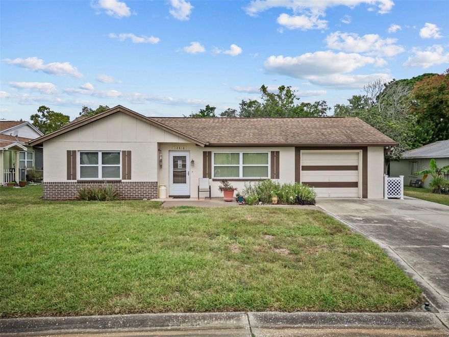 This charming 3-bedroom, 2-bath home offers 1,437 sq ft of well-maintained living space in a quiet, established neighborhood — perfect for those seeking comfort and peace of mind. Enjoy the benefits of NO FLOOD INSURANCE required, providing added savings and security. The home features a 2008 roof and an AC system updated in 2018. Inside, you’ll find a bright and functional layout ideal for both everyday living and entertaining. The spacious living areas flow naturally, and the generously sized bedrooms provide plenty of space for rest and relaxation. Step outside to a low-maintenance yard with room to personalize — whether you're envisioning a garden retreat or a cozy patio space. Conveniently located near shopping, dining, medical facilities, and just a short drive to Florida’s beautiful Gulf Coast beaches, this home blends quiet suburban living with accessibility. Don't miss your opportunity to own a solid, move-in ready home in a desirable Hudson location. Schedule your private showing today!