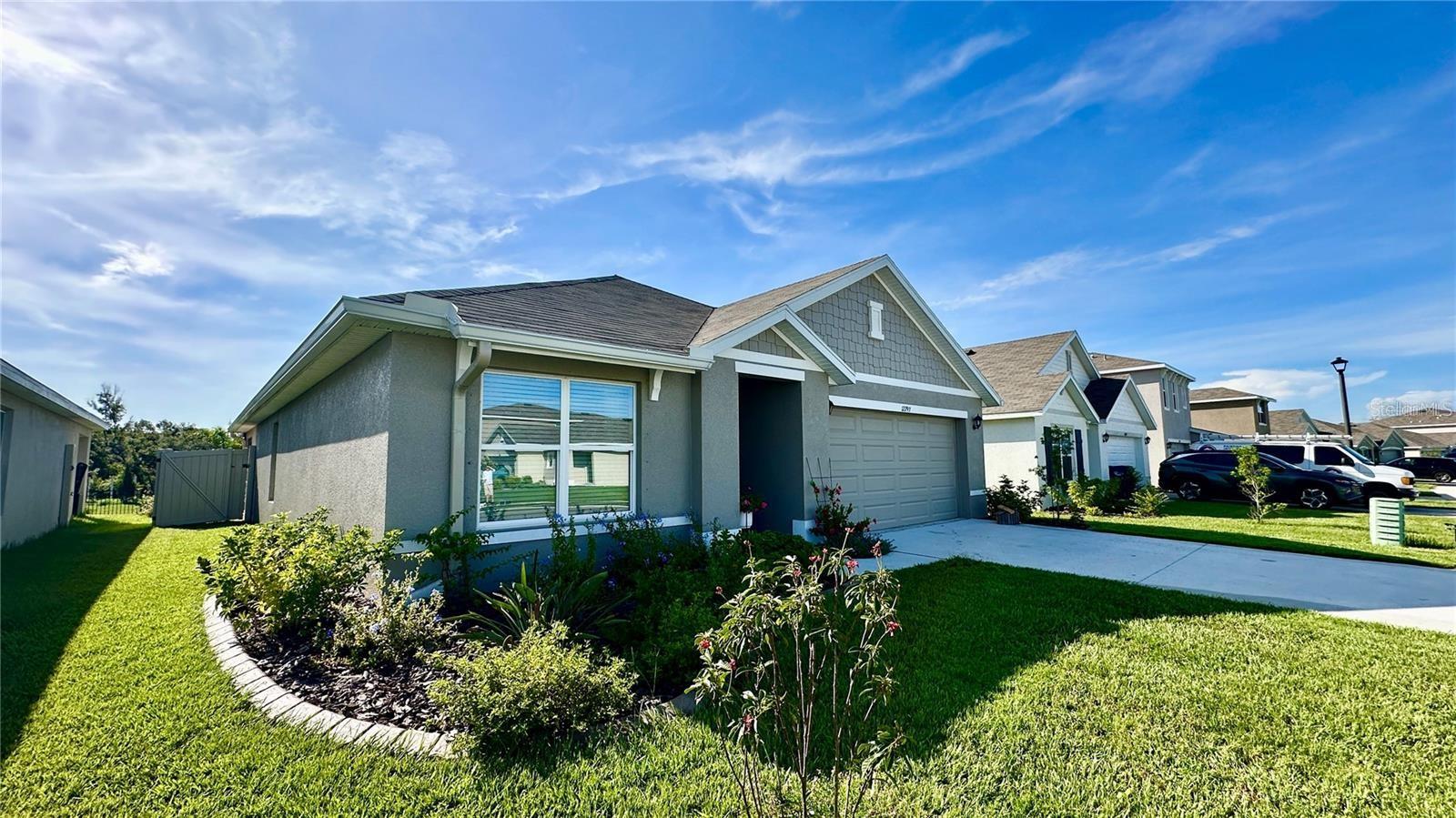 Upgraded and Ready for Move-In! Available September 1st. This beautifully maintained 3-bedroom, 2-bathroom home is located in the highly desirable Bella Lago community in Parrish, FL. With concrete block construction and premium upgrades throughout, this home offers both comfort and style. Enjoy Florida living on the screened-in lanai, which overlooks a fully fenced backyard with lush landscaping and custom curbing. The home includes upgraded features such as gutters, modern cabinet hardware, and a full appliance package including a washer and dryer. Inside, you'll find a spacious open-concept floor plan that creates a natural flow between the kitchen, dining, and living areas. This layout is perfect for everyday living and entertaining. The owner's suite is privately situated at the back of the home and includes an ensuite bathroom. Two additional bedrooms share a second full bath, and a separate laundry room adds extra convenience. As a resident of Bella Lago, you'll have access to fantastic community amenities including two pools, a fitness center, a dog park, and more. The rental includes access to all amenities so you can enjoy a resort-style lifestyle right at home. All the upgrades have already been done for you. Just bring your belongings and settle in. Available for rent starting September 1st. Schedule your showing today!