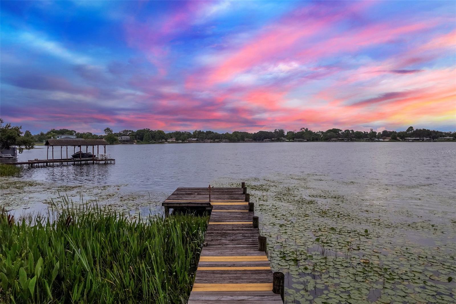 Lakefront Living Minutes from Downtown – Rare Opportunity at a Rare Lakefront Price where you will have instant equity!!
Live the lakefront lifestyle just minutes from downtown Orlando and major attractions. This updated home sits on nearly 1 acre of prime skiable lakefront property—ideal for skiing, boating, paddleboarding, fishing or simply soaking in the sunrise views.
The property includes a total of 4 bedrooms and 3 bathrooms, indoor laundry, updates galore and sits on a huge .93 acre lot with NO HOA!
The main house features 3 bedrooms and 2 bathrooms, 2 living spaces, dining room, with a modern kitchen, updated appliances with gas stove, updated bathrooms, new flooring, and fresh paint—completely move-in ready. The bedrooms offer a split plan where primary has privacy, 2 closets and an en suite bathroom. In addition there is a terrific outdoor patio space that over looks large lot and lake that is access through new sliding doors from the family room and kitchen area. It is the perfect home for entertaining! Over looking the front yard is a large covered porch perfect for greeting your guest or area for kids to play when it is raining!!
A separate 1-bedroom apartment plus an office area offers flexibility for guests, in-laws, or rental income. Currently rented for $1400. Tenant is long term tenant but currently on a month-to-month. The tenant can either stay for immediate income or vacate before closing—buyer’s choice.
When walking down to the dock just keep on going as dock is off to the right. On your way down take not of the metal gate to the left! This space creates EXTREMELY easy access to the property if you want to add on, build a pool or park a camper.
Outside, the possibilities are endless with an almost 1 acre parcel:
• Build an Olympic-size pool
• Create a garden, orchard, or outdoor kitchen
• Park an RV or boat—no restrictions
• Add a soccer field, playground, or detached workshop
No HOA. Maximum flexibility.
Lakefront properties this close to the city rarely hit the market. Don’t miss your chance—schedule your private tour today.
Electrical panel updated to GE, AC is 2020, partial repipe 2012 plumbing is PVC or CPVC