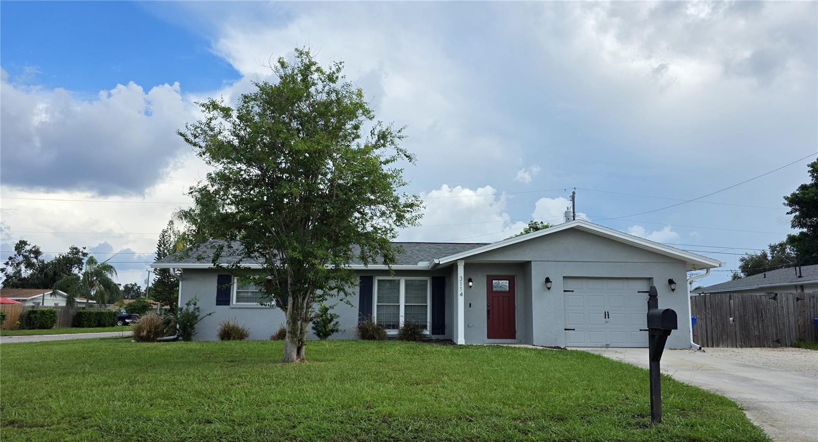 *3 Bedroom, 2 Bath Home with Fenced Yard* Step into this beautifully updated home featuring a spacious open floor plan and stylish wood-plank tile flooring - both trendy and easy to maintain. The modern kitchen is the heart of the home, featuring gorgeous granite countertops, large island with tons of space for cooking and entertaining, and stainless steel appliances. Enjoy the flexibility of a bonus room perfect to use as a home office, playroom, or guest space and relax in the screened lanai overlooking the fenced yard, ideal for pets, gatherings, or simply enjoying the Florida lifestyle. Optional smart-home capability. Move-in ready.