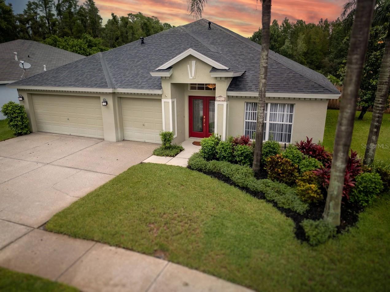 Welcome to this lovely POOL home built by Inland Homes in Deer Run Section of Meadow Pointe. This Devonshire floorplan, showing 2623 square feet of living space, boasts 4 bedrooms, 3 bathrooms, 3 car garage and has had only ONE OWNER. Located on a scenic pond and conservation, updates include New roof and New HVAC in 2019, water heater in 2020, pool resurfaced in 2023 and newer Kitchen appliances and Granite counters. Beautifully landscaped, you will find several areas in the rear yard that have been used as vegetable gardens. The scenic views of wildlife can be seen from sitting on the screened patio and enjoying the caged pool area. The floorplan has Formal Living and Formal Dining rooms, kitchen and family room with large dinette area with views of the pool and rear yard. This is one of the best homesites in the neighborhood with the peaceful views. This is a gas community with water heater, heat to the home, gas range and dryer. Loads of counter space with the granite counters in the kitchen and all three bathrooms. The community of Meadow Pointe offers swimming pool, Tennis courts, Racquetball courts, Fitness Center and Recreation Center. This home location is minutes away from Wiregrass Mall, restaurants of all kinds, easy access to I-75 and the Outlet Mall and shops. NO HOA fees, low CDD fee and ONE OWNER home, very hard to find a great deal like this.