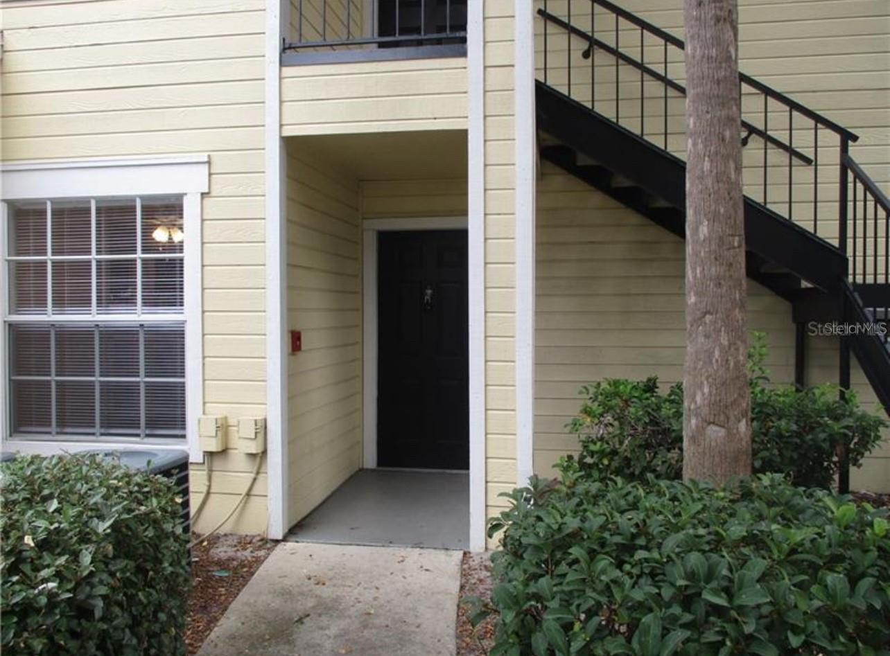Welcome to this charming first-floor unit 2-bedroom, 2-bath condo located in the desirable Tradewinds community in the area of Metrowest, Orlando! This beautifully maintained unit features an open-concept layout with a spacious living and dining room combo, perfect for both relaxing and entertaining. The main living areas boast elegant wood flooring, while the bedrooms have cozy carpet and the kitchen and bathrooms are finished with tile. The kitchen overlooks the living and dining space, adding to the open and airy feel. Enjoy resort-style living with access to two community pools, tennis courts, and landscaped grounds. Located just minutes from Universal Studios theme parks, International Drive, Hotels, Premium Outlet Malls, and a variety of dining and shopping options. With easy access to I-4, 408, and the Turnpike. This move-in-ready condo offers comfort, convenience, and location. A wonderful place to call home. Schedule your showing today!