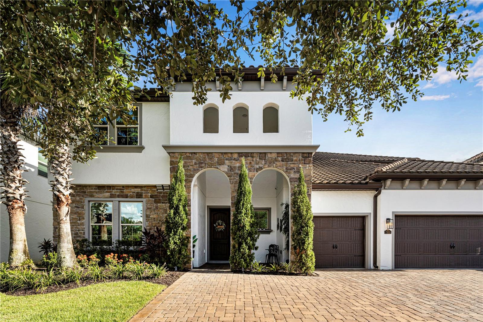 An Exquisite Blend of Luxury and Lifestyle
This exceptional estate redefines refined living, offering 7 bedrooms, 7.5 bathrooms, and a 3-car garage—all thoughtfully designed to merge elegance with everyday functionality.
The heart of the home is the sophisticated main living area, highlighted by bespoke built-in cabinetry and a striking modern wine cellar. From here, the space flows effortlessly into the gourmet chef’s kitchen, featuring granite countertops, top-tier stainless steel appliances, dual center islands, a walk-in pantry, and an inviting breakfast nook. A butler’s pantry seamlessly connects to the formal dining room, setting the stage for unforgettable gatherings and effortless entertaining.
The residence boasts three luxurious master suites, including a primary retreat on the main floor with expansive walk-in closets and a spa-inspired bath complete with a soaking tub and separate shower. Each additional bedroom is generously scaled, with custom built-in walk-in closets ensuring comfort and practicality.
Upstairs, a spacious lounge with a wet bar offers the perfect setting for relaxed evenings or casual get-togethers.
Step outside to your private resort-style sanctuary—a covered patio with a fully equipped summer kitchen and a sleek glass steam sauna overlooking the glistening pool.
Perfectly positioned just minutes from Disney Springs, Flamingo Crossings, and the Premium Outlet Mall, this residence delivers an unrivaled blend of luxury, convenience, and lifestyle. More than a home, it’s an experience—crafted for those who expect nothing less than the extraordinary.