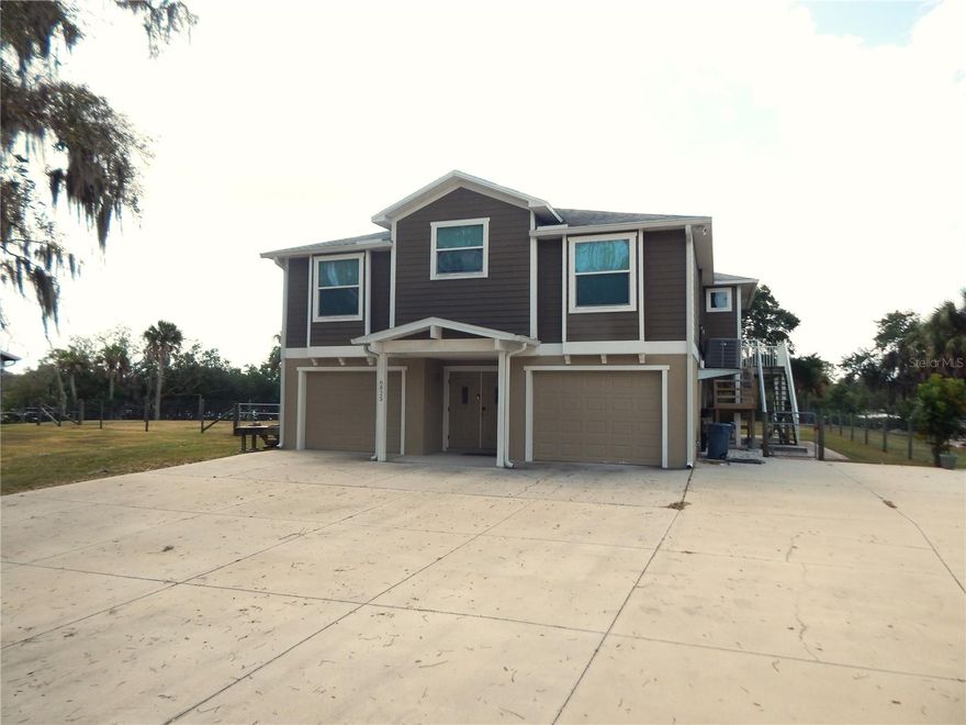 This stunning 3 bedroom 2 bath elevated home, which was built in 2015, is something that you do not see come to the market very
often. A beautiful property sitting on 3.65 acres of mature land with at least 700ft of waterfront. The property boasts fantastic views.
Various forms of wildlife, from manatee's to dolphins, eagles, falcons and more, are seen quite regularly from the elevated deck and
surroundings. A huge yard with a unique pole barn, could be made into just about anything with a little imagination. Plenty of room for
your boats and motor homes, or other toys you may have. The house also has a two car garage with plenty of room to move around
and set up a workshop inside. Inside the home is completely updated, a cozy kitchen with views of the family room and outside. If
you happen to have an older pet or even a younger one, a specially designed walkway next the decks helps get them to the second
floor from the yard with ease. The home also has a bonus of solar power which is owned free and clear.  Do not let this opportunity
pass to purchase this lovely home, the area has a lot of new development and is ever changing fast.  This is a very unique property
and you will be hard pressed to find anything similar, so don't wait, Opportunity knocks..