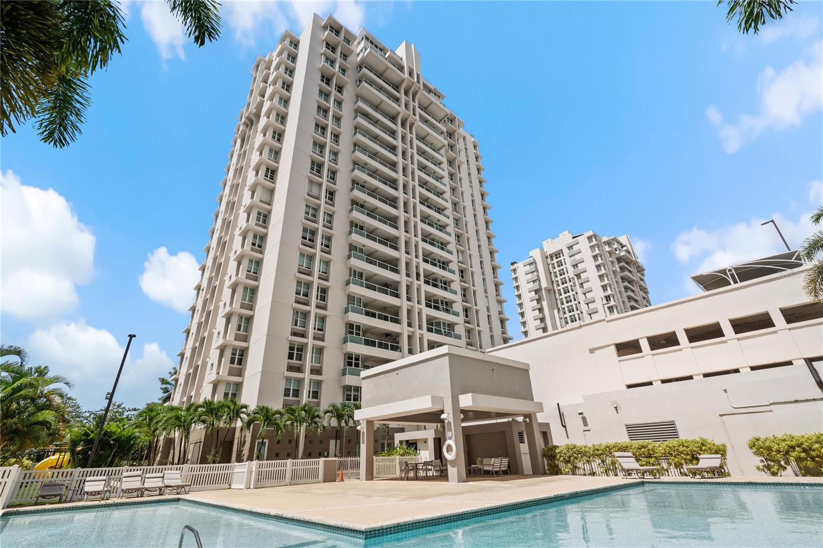 Experience elevated urban living in this exquisite penthouse located in the prestigious Torre Cibeles, right in the heart of San Juan. Boasting panoramic city and ocean views, this luxurious residence offers the perfect blend of modern design and comfort. With floor-to-ceiling windows, high ceilings, and an open-concept layout, natural light floods every corner, enhancing the spaciousness and sophistication of the home.
The penthouse features three generously sized bedrooms, including a lavish primary suite with a private balcony, walk-in closet, and spa-inspired en-suite bathroom. The gourmet kitchen is equipped with top-of-the-line stainless steel appliances, custom cabinetry, and an oversized island ideal for entertaining. Multiple living areas, a formal dining room, and a private rooftop terrace provide ample space for both relaxation and hosting guests.
Residents of Torre Cibeles enjoy 24-hour security, a fully equipped fitness center, a swimming pool, and gated parking. Situated in a prime location, you are just minutes from fine dining, upscale shopping, Condado, Old San Juan, and the airport. Whether you’re looking for a full-time residence or a high-end investment, this penthouse delivers unmatched lifestyle and value in one of Puerto Rico’s most sought-after addresses.