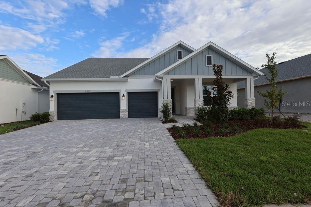 Photo of 31537 Hayman Loop, Wesley Chapel, FL 33545 (MLS # TB8417985)