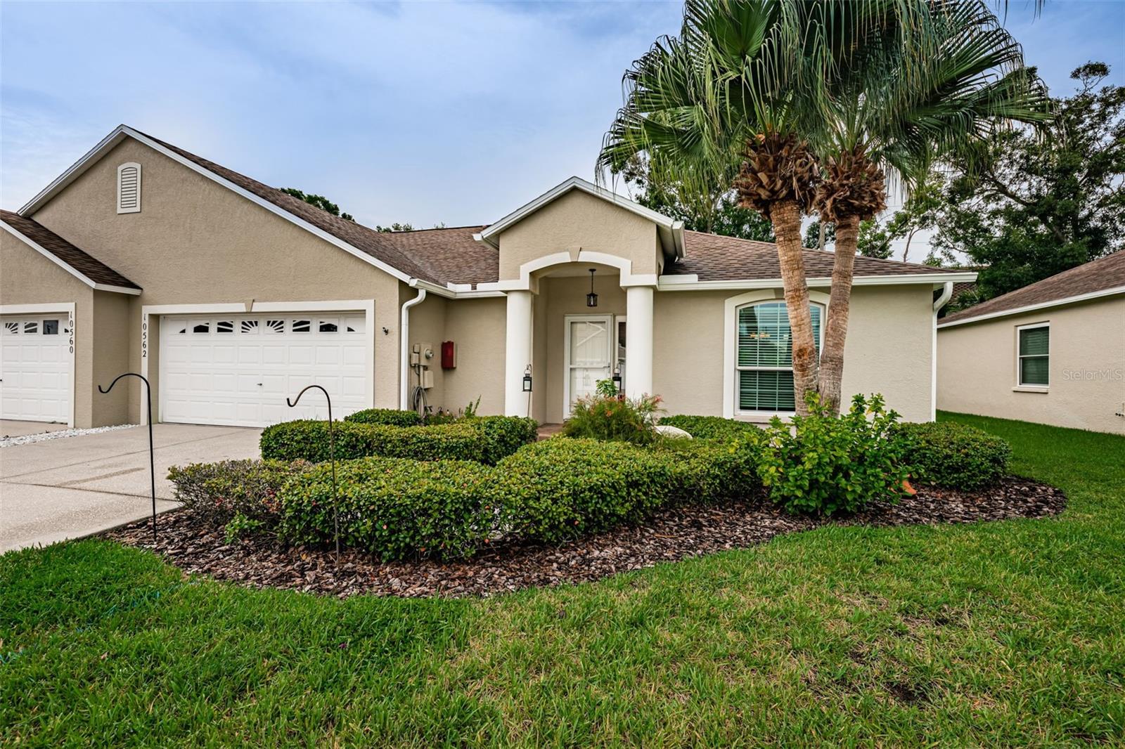 Rarely available 3 bedroom 2 bath 2-Car Garage 1455 sqft ALL-AGES, pet-friendly VILLA in no flood zone along quiet cul-de-sac. This 2002 constructed beauty offers the space of a single family home with some amenities of condominium living - with privacy, yet so close to shopping, dining, Seminole Rec Center, St. Pete College, Seminole City Center, top-rated schools and Gulf Beaches; Aldi's in walking distance! Hurricane impact windows and sliding door new in 2020, new A/C in 2022 with current maintenance contract by Graham A/C. New roof in 2021! The bright eat-in kitchen offers plenty of counter space, a closet pantry, cabinets Galore, breakfast bar & "KitchenAid" refrigerator, range, microwave plus 3-year old "Samsung" dishwasher. The interior features vaulted ceilings, plantation shutters, engineered hardwood flooring with lots of natural light for an airy ambiance in all living areas. The huge master bedroom boasts a large walk-in closet and ensuite bathroom. You will enjoy the inside laundry room with washer & dryer and additional storage. The 3rd bedroom is currently used as an office. An oversized 2-car garage serves perfectly as a man cave with its own TV, work bench and storage shelves, plus a pull-down ladder into the attic. $475 monthly fee includes: building maintenance, including roof replacements, escrow reserves, common area taxes, painting, ground & lawn maintenance, private road, master insurance policy, and mailboxes (no utilities included). Ownership is condominium. Don't delay and schedule your showing today - you won't regret it!