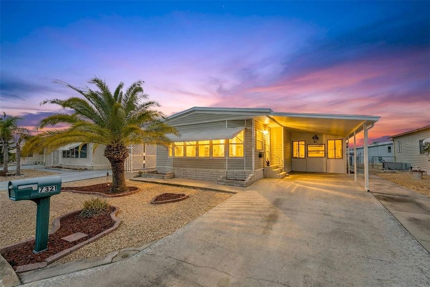 Move-in Ready and spacious 2 bedroom 2 bath home in desirable Ponderosa Park, close to shopping, restaurants, Gulf Beaches and an easy ride to Tampa Airport.  This Community offers an amazing heated pool, active clubhouse, on-site community office, bocci and shuffleboard, all for only $250 per YEAR, and you own your land!!  No Lot Rent!  This home is super clean, and loaded with upgrades, including metal roof-over, enclosed workshop, easy care gravel lawn, screened lanai, awnings, upgraded windows, and best of all, mostly furnished!  Out back, enjoy the custom built raised deck and relax!!  Everything in the photos are included in the sale!!  Inside, there's loads of room, with 1394 square feet of living space, huge living area, central kitchen, cavernous primary suite, all appliances including washer and dryer, luxury plank flooring, meticulous paint throughout, No reason to look any further, this home has it all!!