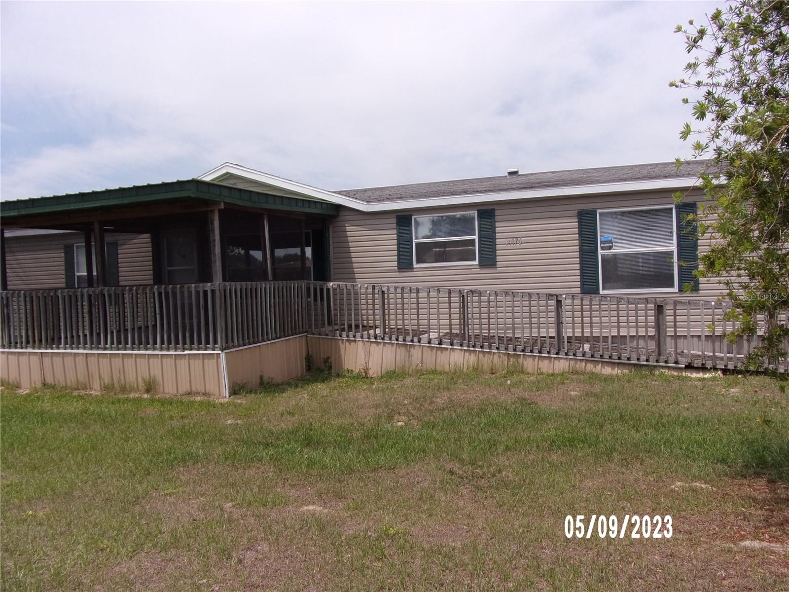 Large 4 Bedroom 2 Full Bath Home with a Real Wood burning Fire Place for those Cold Winter Mornings. Roof & A/C Replaced in 2019, This is a true Split Floor Plan. As you enter into a Large Dining Area opened to the Living room-Big Kitchen with a Island and a Good size Eating area that flows into the Family with the Fireplace Great for the Holidays!! Good size Laundry Room that leads to a side Deck to back yard. Front of the Home has a ramp to the Front porch with screens. Fenced back yard with a Shed. Convenient to Schools-Villages-Ocala-Shopping & Medical & I-75. Interior Freshly Painted 2021- Newer Carpets in 3 Bedrooms. This is a Good Home for a Family that needs a lot of Space! ( 2,280 Sq. Ft. )