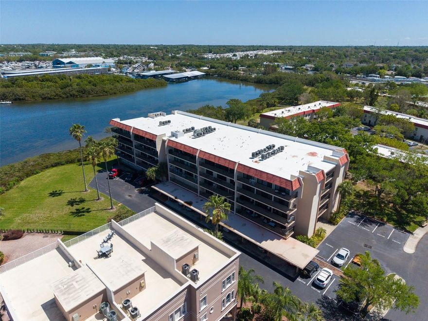 Enjoy beautiful coastal and water views from your expansive 36' private balcony! This light-filled 2-bedroom, 2-bath split floor plan offers balcony access from both bedrooms and the living/dining area. Offered furnished for added convenience. Enjoy covered parking, secure building access, and an elevator for easy access. Residents have access to a private waterfront park, clubhouse, recreation building, and heated pool. Ideally located near multiple marinas with direct access to the Gulf and just minutes from Honeymoon Island and downtown Dunedin. Monthly condominium fee includes building insurance, internet, and community amenities.