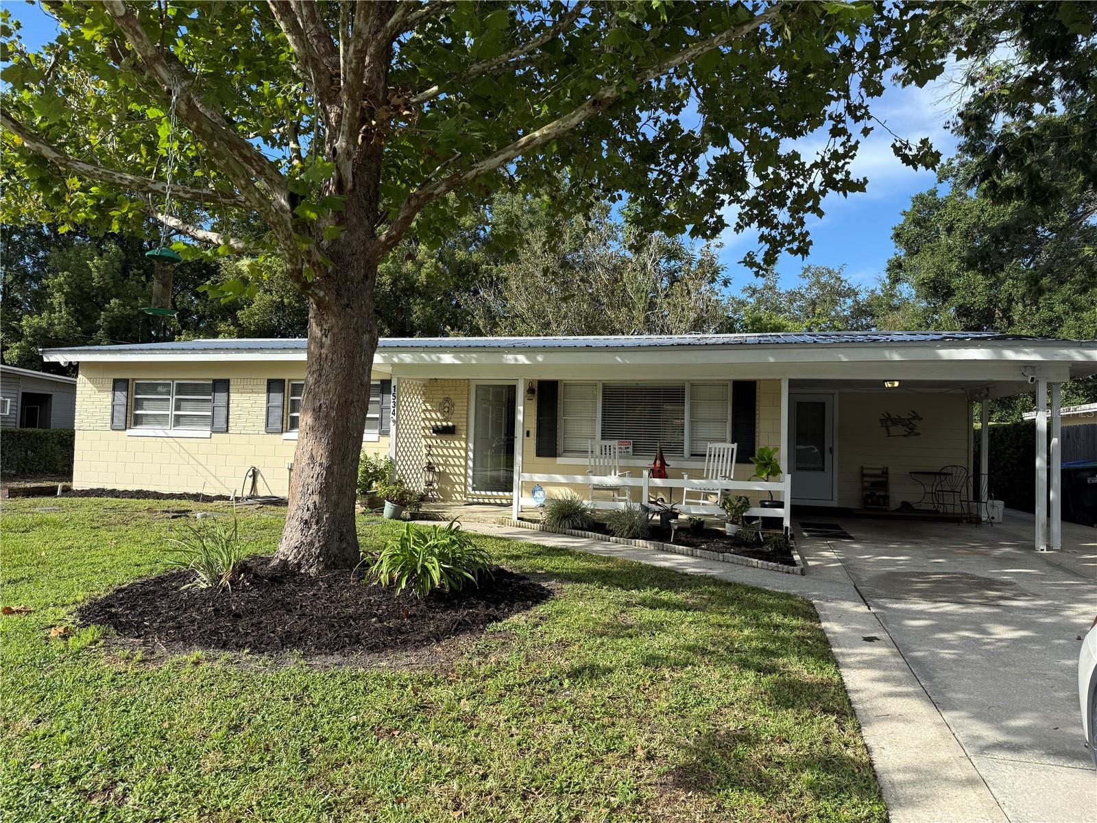 Welcome to this 3-bedroom, 2-bath home with 1,562 heated square feet. The interior has been freshly painted and features an open floor plan with a bright family room, coat closet, ceiling fan, and blinds. The primary bathroom has been updated with a newer vanity, shower, and tile, while the kitchen offers a newer flat-top stove. The inside laundry room, which includes a washer and dryer, is located just off the main living area and is not under air. Additional updates throughout the home include new 6-panel doors with updated hardware, blinds, and ceiling fans.The exterior features a fully fenced, shaded backyard and a spacious 17’ x 24’ workshop equipped with electric, shelving, and a 60-gallon air compressor. A glass storm door at the entry provides both natural light and extra security. Ring doorbell and cameras will remain with the home.Important system updates include an electrical panel installed in 2018, HVAC replaced in 2021, partial replumb with copper and PVC, a water heater installed in 2003, and a durable metal roof from 2015 for long-term peace of mind. A 2023 four-point inspection is also available. This property has been well maintained and is move-in ready. This property has been well maintained and is move-in ready. Bring your buyers to this home and you will not be disappointed.