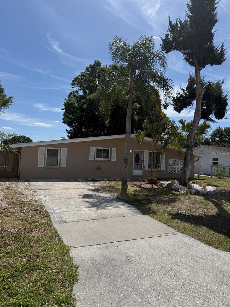 THIS 4 BEDROOM 2 BATH HOME HAS RECENTLY BEEN UPDATED WITH UPGRADES  FOR EASY MAINTENANCE FREE LIVING. A LARGE FENCED IN BACKYARD FOR PRIVACY & BARBECUES. PERFECT LOCATION IN CENTRAL SARASOTA CLOSE TO DOWNTOWN AND BEACHES. CHECK IT OUT YOU WILL BE GLAD YOU DID! NEW ROOF 2021 NEW ELECTRIC 2021 NEW AC 2025