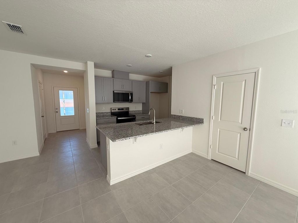 Photo of 16607 Luminary Loop, Clermont, FL 34714 (MLS # O6402405)