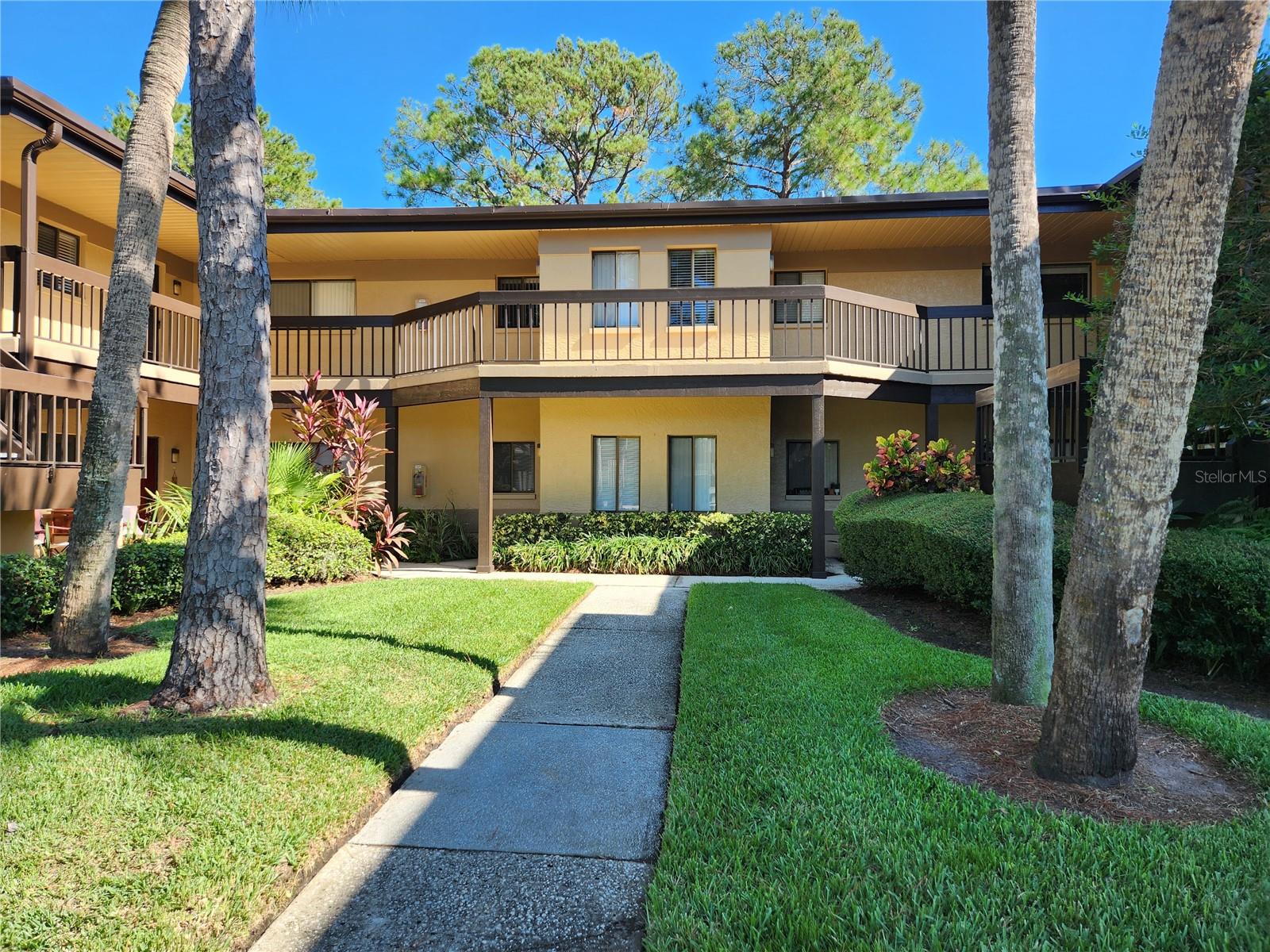 Beautiful 2/2 Ground Floor condo overlooking pond. Move in ready for you! Eat-in Kitchen with window has brand new oven-range and new microwave. Tons of cabinets and room for small cafe table if you like. Living room / dining room combination with sliders out to porch overlooking pond and fountain. Split bedroom plan. Master bedroom has ceiling fan and walk in closet and sliders out to porch as well. Master bath has large walk-in shower and newer elongated toilet. Guest bedroom has ceiling fan and good sized closet. Guest bath has tub with shower. Linen closet outside guest bath. Laundry closet with newer full sized washer and dryer. Building I is located directly across from the pool and catty corner to the tennis courts. One assigned carport space and tons of guest parking. Rent includes water, sewer, trash and cable. Misty Springs is right across from Countryside Mall and convenient to everywhere. No age limits and no pets allowed. Make time to come and see this beauty. You will LOVE living here!