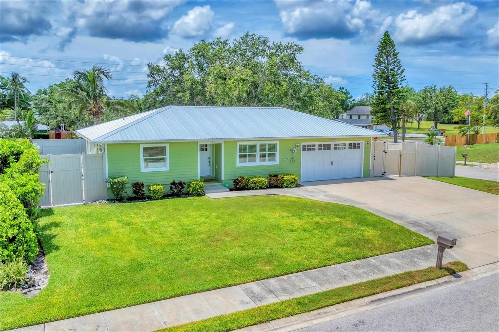 Discover Florida, living at its finest in this breathtaking home, perfectly positioned on a spacious corner lot. As you step inside, you'll be welcomed by a warm, inviting living room filled with natural light, seamlessly connecting to a generous kitchen, dining area, and cozy TV space — all enhanced by elegant French doors that open to the lanai. The kitchen is a chef's dream, offering ample cabinets, abundant counter space, and a large island that provides extra storage and a perfect spot for casual dining. With sleek stainless steel appliances and stunning quartz countertops, this space is not only functional but designed for unforgettable entertaining experiences. This thoughtfully designed split floor plan ensures privacy for everyone. On one side of the home, discover two spacious bedrooms accompanied by a full bath, while the luxurious primary suite awaits on the opposite side. The primary features a large walk-in closet and an exquisite ensuite bathroom, complete with quartz countertops and an oversized tiled walk-in shower with double showerheads. Easy access to the lanai through French doors makes this suite even more enticing. Step outside to the lanai and be captivated by the picturesque view of the sparkling pool and beautifully landscaped backyard. The backyard boasts a pool with stunning fountains, a built-in fire pit for cozy nights, and a covered dining area with quartz countertops — a perfect spot to unwind and entertain. There is an oversized shed and other small storage units. There is also ample space to park your RV or boat on either side of the house. Located close to the scenic Robinson's Preserve and DeSoto National Memorial. This home could be sold turn key, perfect opportunity for an investor or second home. Newer metal roof (2021). Newer A/C (2021). New electrical (2021). Is this your perfect match? Book your showing today!