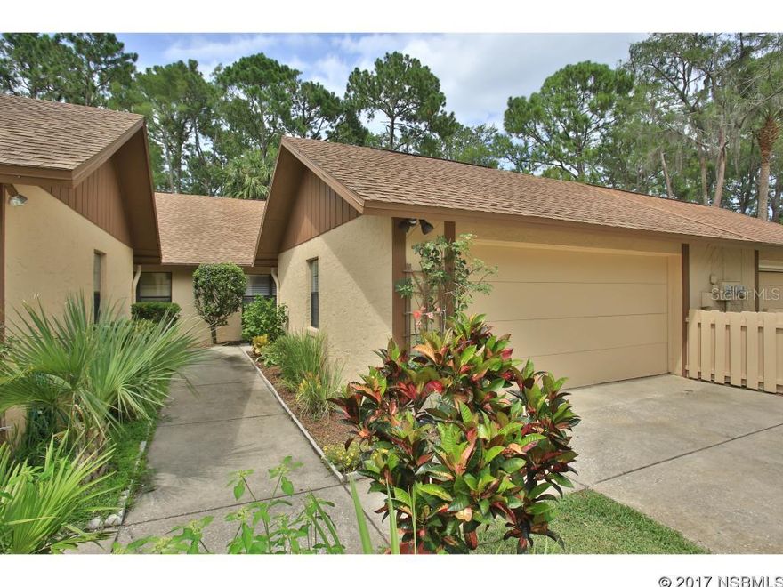 MAINTENANCE FREE LIVING!!  THIS ATTACHED HOME IS LOCATED ON A QUIET CUL-DE-SAC AND FEATURES 2 LARGE BEDROOMS, 2 BATHS, EAT IN KITCHEN, LIVING/DINING COMBO, INSIDE LAUNDRY, STONE ELECTRIC FIREPLACE THAT HEATS UP, REAL HARDWOOD FLOORS IN LIVING AREA AND MASTER BEDROOM.  TILE FLOORING IN KITCHEN, FOYER & BATH.   EAT IN KITCHEN, WASHER & DRYER. 2 CAR GARAGE.  HOA COVERS LAWN CARE, TERMITE BOND, BASIC CABLE AND EXTERIOR PAINT.   BEAUTIFUL GOLF COURSE  COMMUNITY, CLOSE TO SPEEDWAY, COLLEGES, BEACHES, SHOPPING AND RESTAURANTS.  FURNISHINGS AVAILABLE.....ALL MEASUREMENTS ARE APPROXIMATE. ;Water: City