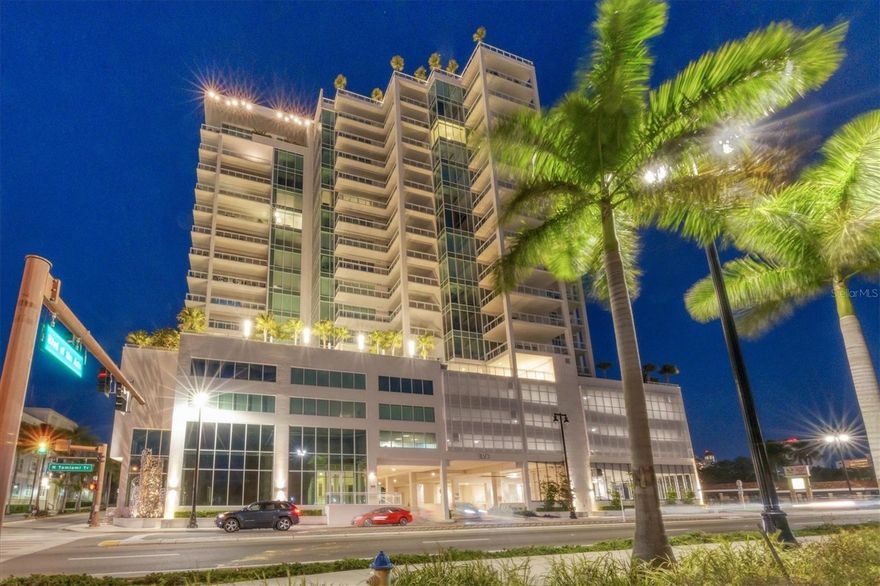 This towering condominium in the sky, with a deeded air-conditioned garage and additional spaces for four cars, is located in the most desirable end stack in the building. It boasts some of the most breathtaking, unobstructed views of the bayfront, the Gulf of Mexico, and sparkling downtown Sarasota city lights. The unit flows through the entire depth of the building, from front to back, and is enhanced by an ultra-expansive, wrap-around outdoor terrace that’s over 200 feet long, complete with multiple dining, seating, and lounging areas. This iconic building, BLVD, is located directly across the street from the new 53-acre Bay Park project. The area is considered the new heart of downtown, with the park’s waterfront walkability, performing arts center, band shelter, food concessions, garden club, auditorium, kayaking lagoon, butterfly garden, sunset deck, sand beach, fitness activities, and public boat ramp. Inside the finely appointed condominium, which boasts 3,630 square feet of living space and 5,330 square feet overall, it features three spacious bedrooms with ensuite baths and terrace access, plus four and a half baths. A private access elevator opens directly into the foyer, which features oversized walls for art. From here you’ll find a large great room with 11-foot ceilings, an open dining area, floor-to-ceiling impact-rated windows and doors, and bayfront views that are never-ending. The stylish kitchen is perfect for preparing meals and entertaining guests. This central area includes a large marble-tiled island, quartz countertops, appliances that feature Sub-Zero refrigeration, a Wolf oven and five-burner natural gas cooktop, Asko dishwasher, and an Axor kitchen faucet. There’s also premium, custom cabinetry designed in Italy by Irpinia, under cabinet lighting, plus two walk-in pantry closets, each outfitted with oak shelving. Throughout the residence, there are 12 by 60-inch wood-grain porcelain tile and eight-foot solid core doors. The baths feature custom cabinetry, quartz and marble countertops, Kohler plumbing fixtures, frameless glass shower enclosures with multiple spray heads, and full-wall vanity mirrors. Each primary bedroom suite features two walk-in wardrobe closets, with built-ins. A powder room and a separate laundry room are conveniently located off the main hall. In every room of the unit, there are Lutron-controlled motorized window shades and added block-out drapery. This inspiring condominium comes with its own air-conditioned two-car garage with an oversized wall-to-wall window, plus two premium secure, side-by-side parking spaces that are located in the best building location. The unit also has a large, humidity-controlled private storage locker. BLVD hosts only 49 residences and its unique amenities set it apart from other luxury condominiums. Building amenities include an infinity-edge rooftop pool, an outdoor rooftop kitchen with dining areas, chaise loungers, and seating groups for sunset views. The building also affords a reception lobby, secure building access, an owner’s wine room with personal lockers, a fifth-floor outdoor pet lawn, a grooming station, golf simulator room, lounge with bar, boardroom, and a state-of-the-art fitness center. BLVD is intimate, spirited, and rich with fine appointments, features, and amenities. Visit this unit today and see the fine art of downtown living.