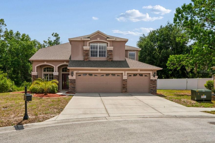 LOCATION,LOCATION, LOCATION! One of the best lots in Waters Edge, cul-de-sac street, conservation area in this beautiful community one neighbor on a side. Ashford II " model. 5 bed. or a huge play room / 3 bathrooms/ 3 car garage. . The first floor features formal living/dining room combo, kitchen with breakfast bar. Granite counter-tops, neutral color backslash, 42' cabinets. Guest bedroom and full bath are downstairs. Inside utilities, big pantry. Nice screened in lanai over looking conservation area, great for entertaining. Upstairs features nice sized master bedroom with a baby room or office space, walk-in closet. Bathroom has garden tub with separate European style showers, double sinks and linen closet. 3 additional bedrooms and huge game room and additional bathroom. Freshly Painted inside . BRAND NEW ROOF was put on last year . All floors and stairs replaced with wood laminate. Community includes: community pool, splash pad, basketball courts, tennis courts, playground 2 piers out to the lake, community boat ramp, clubhouse, fitness center.Great location: Short distance to the grocery store and several restaurants. Downtown New Port Richey is a historic Rivertown community in north Tampa Bay with award-winning restaurants, shops, bars, and breweries. Its rich history is preserved by the Hacienda Hotel, Richey Suncoast Theatre, and the New Port Richey Museum. The nearby Pithlachascotee River offers boat docks, kayak launches, and a chance to see dolphins, manatees, and native Florida wildlife. While the James E. Grey Preserve offers an 80 Acre  Wildlife Sanctuary just minutes from downtown New Port Richey. There’s natural amenities like Sims Park and the Cotee River waiting to be explored. It’s not far to the famous Tarpon Springs Sponge docks and only 25 miles to Tampa International Airport. Enjoy everything that Tampa Bay has to offer from the new Downtown Riverwalk, top U.S. Beaches, boating, fishing, golfing, cultural entertainment, and museums. And of course year-round beautiful weather.