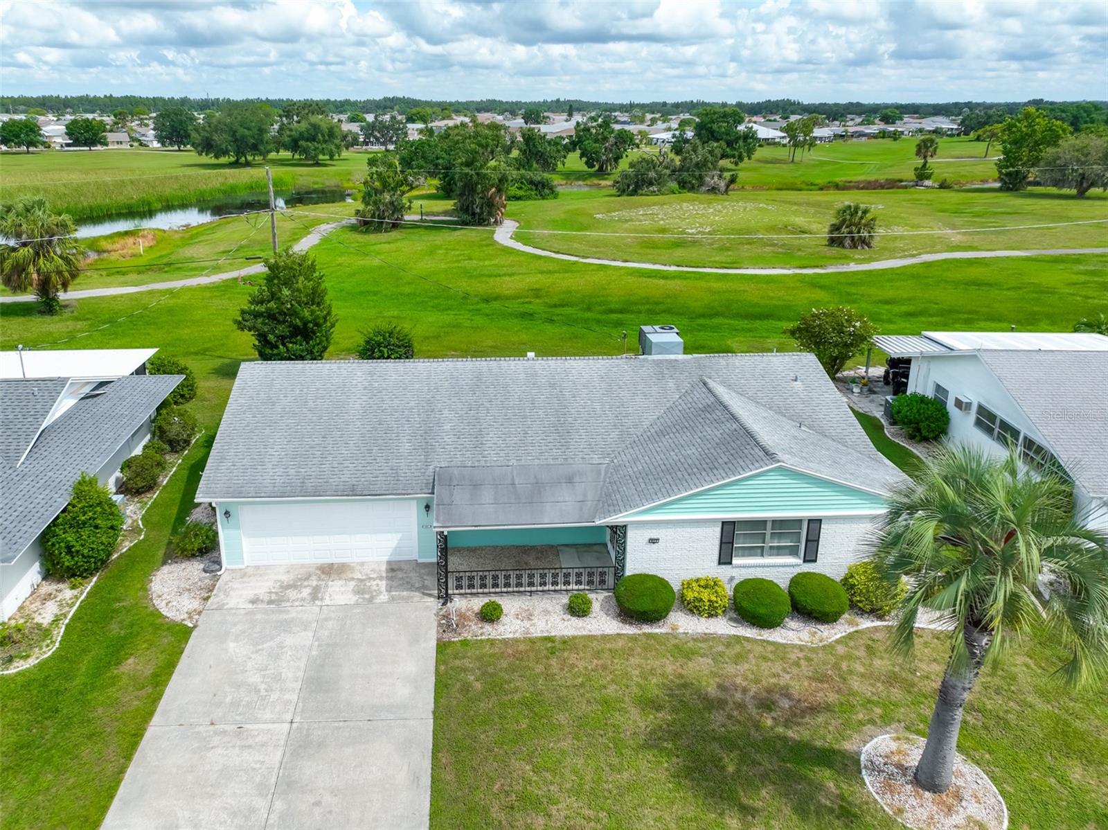 WELCOME TO YOUR CHARMING, FRESHELY PAINTED HOME- NO HOA REQUIRED! Nestled on the North side of Sun City Center this lovely home features Florida friendly landscaping, lush green lawn, & newly painted exterior lending to the homes fantastic curb appeal. With its vintage charm & plenty of potential you can transform this property into your dream home. From the moment you walk up to the quaint front porch & step inside you will be delighted by the recently painted light grey interior color scheme, freshly clean Berber carpet, spacious rooms & closets, and several new fans. There is an eat-in kitchen and roomy dining room with abundant counter space & cabinets that open onto your enclosed lanai, perfect or relaxing and entertaining family & friends. Enjoy extra living space and the convenience of built-in shelves ideal for morning coffee as you sit and plan your day Your oversized primary bedroom has a generous walk-in closet and a built-in dressing vanity, and the ensuite bath has a convenient walk-in shower. The guest bedroom & bath provide comfort and ample closet space and because it’s filled with vintage appeal, including built-in cabinets that are ideal for storage and organization. The interior laundry room is equipped with a washer, dryer, & handy overhead cabinets. A rear door makes it easy to access your yard where you can relax in the open space behind the home and watch the birds or tend to your plants & flowers. UPGRADES: 2025 Hot Water Heater, 2025 Interior & Exterior Painting, 2019 York HVAC, 2013 Roof, 2004 Replumbed. This home has plenty of vintage charm & with the right vision you could create a personalized retreat or make a smart investment-supported by excellent rental history and strong future potential-this home offers exceptional possibilities. Sun City Center (SCC) is a vibrant & active 55+ golf cart community. It is close to airports, beaches, shopping & big city nightlife & entertainment. Residents can enjoy outdoor pools & spas, a well-equipped fitness center, a community hall, library, arts/crafts, outdoor sports, Lawn bowling, Pickleball and golf. Don’t miss your opportunity -schedule a showing today! Start enjoying your new SCC lifestyle. This home is priced to sell-you will love calling it yours!
