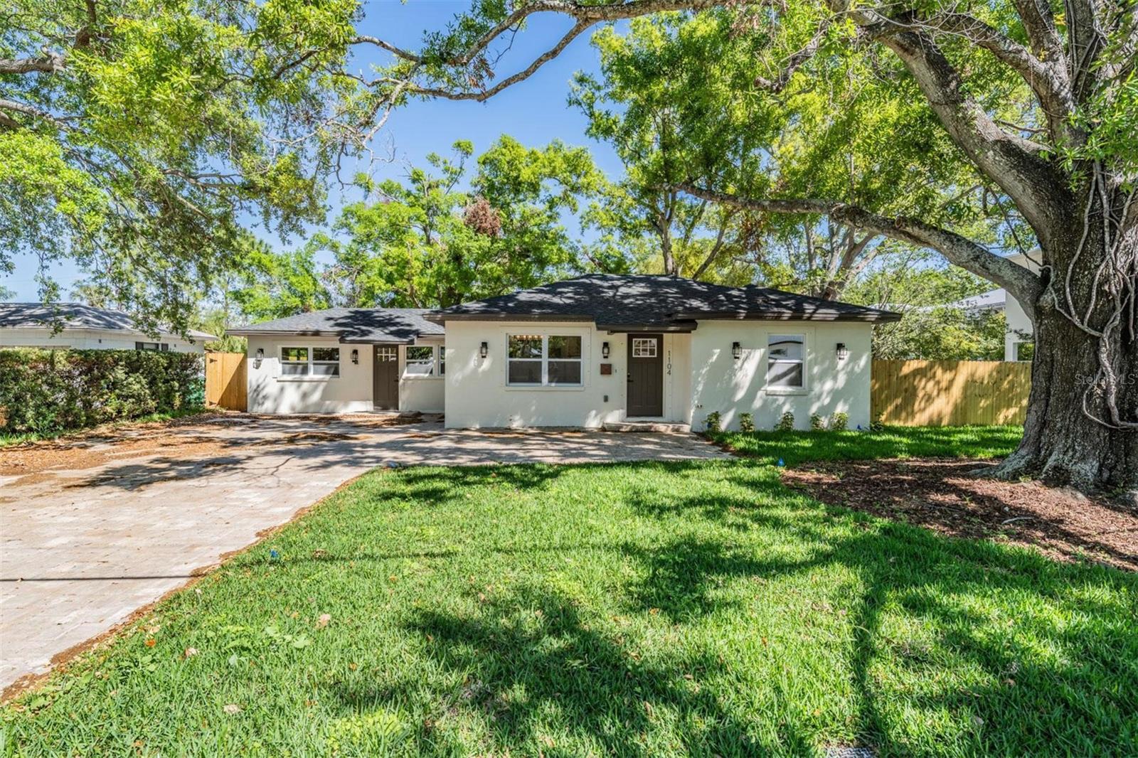 Remodeled & Zoned for Top A-Rated Schools! Welcome to 1104 S Lois Avenue, this is not your typical 1950's South Tampa home. This beautifully remodeled gem is nestled in the highly sought-after Grady, Coleman, and Plant school district. This LIKE-NEW HOME has been completely transformed from the studs and has been meticulously reconstructed with high-quality materials and craftsmanship complete wiith modern upgrades and timeless charm, making it truly move-in ready for its next owner! Every detail has been thoughtfully updated, including a BRAND NEW ROOF (2024), NEW ELECTRICAL AND PLUMBING (from the house to the street 2024), new doors, new high impact windows, new stucco, new water heater, new front irrigation system, new custom three point turn driveway, new lights and high sensitivity motion lights new, brand-new luxury flooring throughout, and brand-new premier appliances, including a double-zone beverage craft refrigerator that makes two types of ice! With 3 bedrooms, 2 bathrooms, and 1,599 sqft, this home offers both elegant style and functionality. Step inside to a warm and inviting interior, where a spacious living area provides the perfect setting for relaxing or entertaining. The chef’s kitchen boasts brand new stainless steel appliances, wine refrigerator, air fryer in the stove, and ample cabinetry, ensuring a seamless cooking experience. The primary suite serves as a private retreat, while the additional bedrooms offer flexibility for guests, family, or a home office. The bathrooms feature Bluetooth fog-free mirrors that play music, adding a luxurious and high-tech touch. Beyond the beautifully updated interior, this home sits on AN OVERSIZED LOT (over 1/5 of an acre) which is few and far between in South Tampa providing endless potential creating your own private outdoor oasis. The backyard slab is perfect for a fire pit pad and FULLY FENCED IN, creating a cozy space for gatherings and maximizing privacy. Located in a non-flood zone, this property has had no water intrusion, flooding, or damage from recent storms. Plus, its prime location puts you just minutes from Bayshore Boulevard, Tampa International Airport, downtown, Channelside, Hyde Park Village, and the Tampa Riverwalk, offering the best of South Tampa’s shopping, dining, and entertainment. Don’t miss your chance to live in one of Tampa’s most desirable neighborhoods. Schedule your tour today!