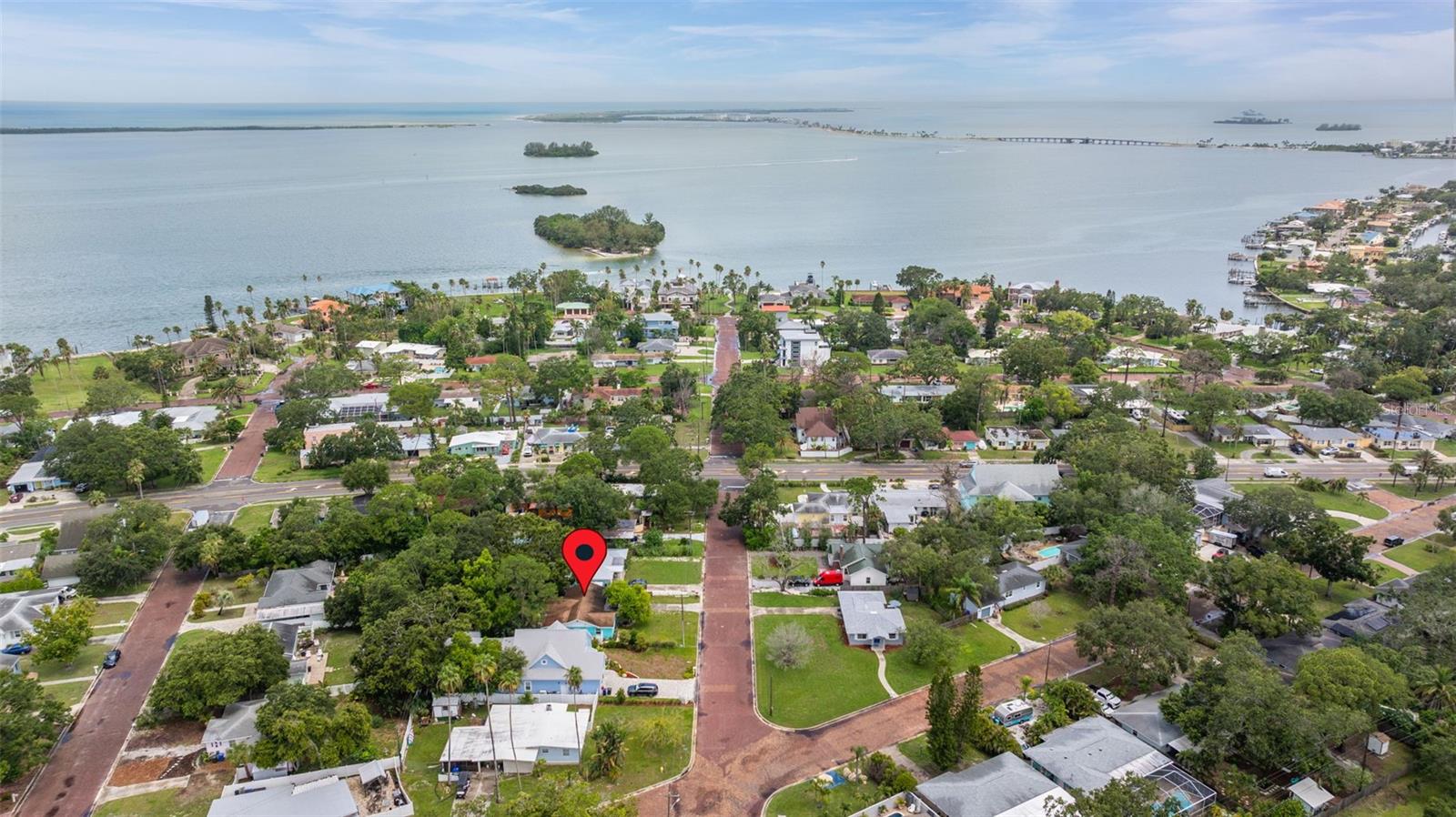 Enjoy coastal charm in this beautifully updated Dunedin home, perfectly positioned on a quiet brick-lined street just one block from the Gulf of Mexico. Located between Downtown Dunedin and the white sands of Honeymoon and Caladesi Island, this 3-bedroom, 2-bath home offers the best of Florida living, without the need for flood insurance. Step inside to find a bright and inviting layout featuring a split bedroom floor plan and luxury vinyl plank flooring throughout the majority of the home. The kitchen has been tastefully updated with granite countertops, stainless steel appliances and opens seamlessly to the spacious dining and living areas. Just off the kitchen, you’ll find a generously sized laundry room complete with washer, dryer, and additional storage space. The primary suite is tucked away for privacy and features a stunning, newly renovated en suite bath with a glass enclosed walk-in shower. The sunroom is the perfect spot to start your day with coffee in hand, overlooking the oversized fully fenced backyard. There’s plenty of space to add a pool, and a storage shed is already in place for your beach gear and bikes. With the Pinellas Trail just a block over, Hammock Park nearby, and a brand-new $1.4M aquatic complex on the horizon, outdoor recreation is steps away. Whether it’s biking, jogging, or exploring winding nature trails, this neighborhood makes it easy to stay active. Just minutes from your doorstep, you’ll find the charm of downtown Dunedin—with its locally owned boutiques, coffee shops, breweries, and an impressive calendar of festivals and events throughout the year. Baseball fans can catch spring training games at the nearby stadiums of the Toronto Blue Jays and Philadelphia Phillies. Beach days are always within reach, with Honeymoon Island and Clearwater Beach only a short drive away. And when you're ready to explore more of the Gulf Coast, nearby causeways make accessing surrounding beach towns and waterfront parks a breeze. Whether you're searching for a forever home, seasonal getaway, or an ideal investment, this Dunedin gem offers something for everyone. Schedule your showing today!