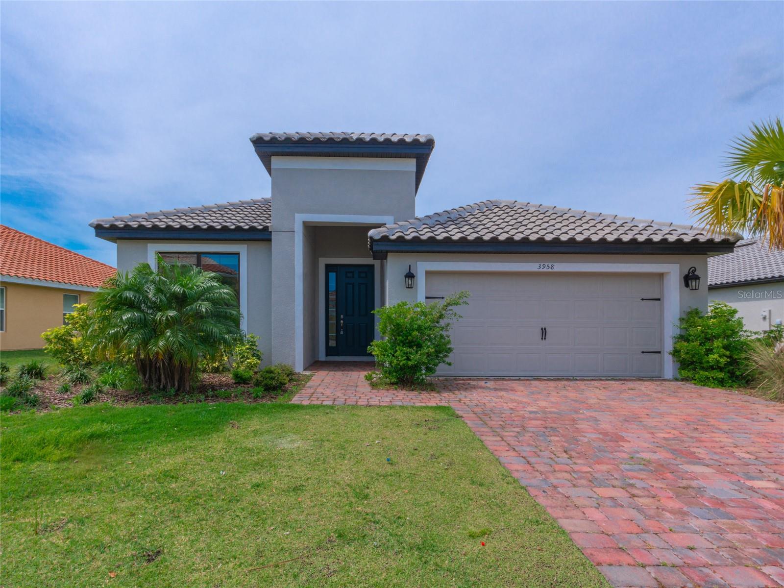 Now you can live the lifestyle of the rich and famous without breaking the bank in this gorgeous lakefront home located in the highly sought-after 24 hours private security guarded gated Bellalago community on the shores of Lake Toho. This beautiful 3-bedroom, 2-bathroom home boasts a spacious open floor plan, perfect for entertaining guests or spending time with family. The spacious living area features large sliding doors that let in plenty of natural light and lead out to the lanai, where you can enjoy the breathtaking lake views. You can even build your own dock and have your boat right outside your home! The kitchen features a large breakfast peninsule with quartz countertops, modern stainless steel appliances, ample cabinet space, and a casual dining room/breakfast nook. The adjacent formal dining room is perfect for family dinners or entertaining guests. The home also features a separate home office, perfect for working remotely or running your own business from the comfort of your own home, a separate laundry room and a two-cars garage. The luxurious master suite is a true oasis, with a spacious bedroom with large windows overlooking the lake, his and hers walk-in closets, and an en-suite bathroom complete with a soaking tub and separate large shower. The two additional bedrooms are spacious and share a full bathroom. Bellalago offers unparalleled resort-style amenities, including two clubhouses with fitness center, multiple swimming pools, playground, tennis courts, a restaurant by the lake, a fishing pier, private access to Lake Toho through a state-of-the-art boat lift and ramp, bike and walking trails thru the beautiful trees and gardens, plenty of activities and fun for the residents and a lot more! Enjoy the peacefulness of living the true Florida lifestyle with the convenience of being just a short drive from all the shopping, dining, and entertainment options that the greater Orlando/Kissimmee area has to offer. Don't miss your chance to live the life of your dreams in this stunning lakefront home in the exclusive Bellalago community. Contact us today to schedule your private showing!