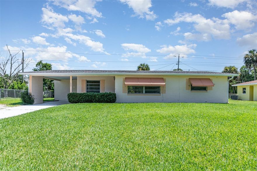 Charming single-family residence featuring an open-concept layout that allows for a smooth flow between rooms.  Upon entering, you are greeted by a delightful living room with a lovely window space that offers views of the stunning blue skies, a true FL retirement haven!  The residence boasts travertine flooring throughout, complemented by new carpeting in the bedrooms!  The kitchen cabinets provide ample storage, with the sink located to overlook the nice porch!  The spacious screened-in porch offers plenty of room for an afternoon coffee break, and for children to enjoy and play.  The huge front yard is exceptionally green, and the driveway can accommodate up to four vehicles.  A sturdy wood and metal shed for extra storage in the backyard!  Your roof is about 12 years old, and the HVAC and water heater system are about 15 years old.  Location!  This property is located in a quiet neighborhood, and conveniently close to beach activities.  Make this charming home yours today!