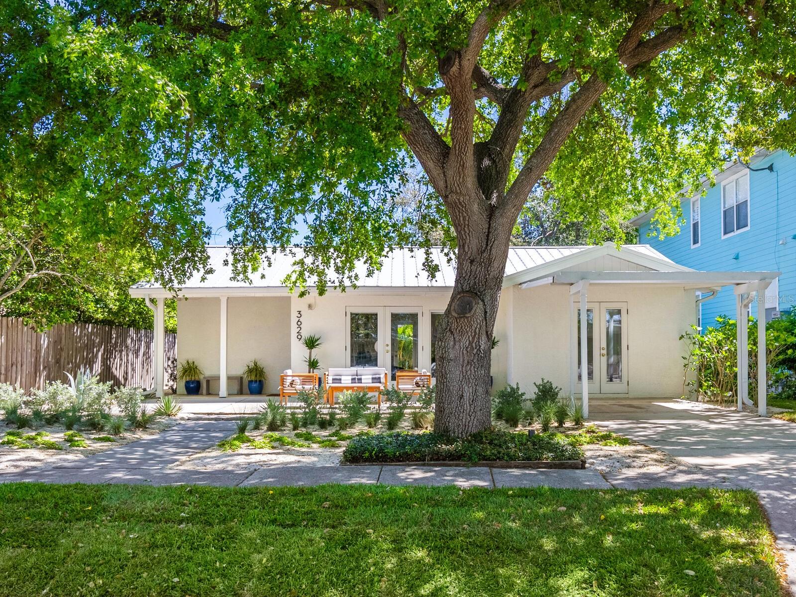 This is a rare opportunity to own a warm and welcoming mid-century gem in the heart of Granada, one of Sarasota’s most coveted West of Trail neighborhoods. Just minutes from the world-renowned Siesta Key beaches, this light-filled bungalow blends vintage charm with modern peace of mind. Step inside to discover a thoughtfully designed layout featuring two bedrooms, two baths plus a versatile den/office, a formal dining room that can easily serve as a third bedroom and a spacious family room ideal for entertaining. Enjoy seamless indoor-outdoor living with newly landscaped front and back yards, complete with irrigation and multiple patios ideal for dining, lounging or hosting under the Florida sun. Built with concrete block construction, a durable metal roof and new impact-rated windows, this home is built to last and it’s close to the water while not in a flood zone. The fenced-in backyard offers privacy and plenty of room to add a pool, while a detached shed provides extra storage. Whether you’re looking for a charming full-time residence, a low-maintenance coastal retreat or a potential income-producing rental, this property checks all the boxes and opportunities like this in Granada don’t come around often.