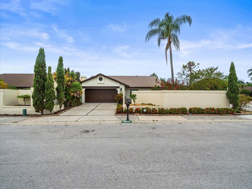 We are pleased to present this BEAUTIFULLY UPDATED CARROLLWOOD VILLAGE home featuring an open, light and bright floor plan, 1596 sq. ft. of spacious living, 3 bedrooms, 2 full baths, oversized 2 car garage, and a meticulously maintained CORNER LOT with lush landscape, raised beds, putting green, and privacy wall. UPDATES include: a MAGNIFICENT NEW KITCHEN (2023/2024) with custom cabinetry, granite counter tops, and stainless-steel appliances; UPDATED BATHS (2024, 2023, 2022); NEW TANKLESS WATER HEATER 2024; NEW GARAGE DOOR OPENER (2024); NEW WINDOWS (2024) in secondary bedrooms; NEW ROOF (2023); NEW PAINT (2023); EXTERIOR PAINT (2025); wood burning fireplace; a GORGEOUS POOL PACKAGE with NEW FILTER and Saline pump (2024), resurfaced (2020); large deck and enormous screened enclosure; immaculate interior/exterior condition and more! Just a short walk from the new Carrollwood Village Park featuring picnic shelters, a dog park, outdoor chess boards, outdoor ping pong tables, walking trails, outdoor fitness equipment, and a skate park and splash park, this fabulous home is also conveniently located to neighborhood tennis courts, playgrounds, the Carrollwood Country Club, shopping, dining and much more...a wonderful place to call home!