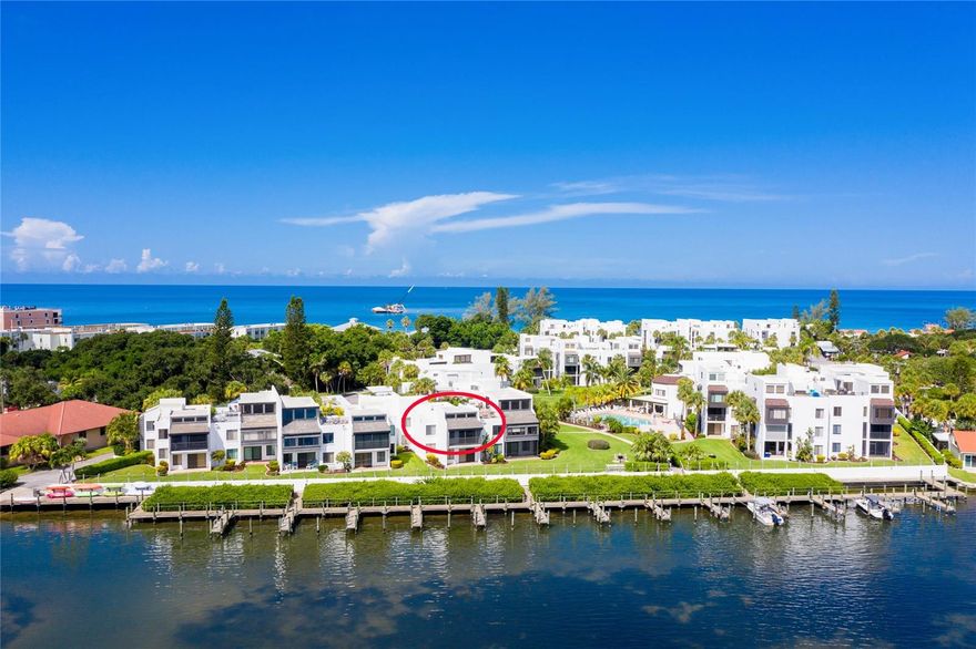 AMAZING 2 BED/2 BATH * 2ND FLOOR CONDO * SITTING DIRECTLY on LEMON BAY with VIEWS of WATER, BOAT SLIP and SEA LIFE * 2 MINUTE WALK to PRIVATE BEACH on the GULF OF MEXICO * LOCATED in the HIGHLY DESIRABLE TAMARIND GULF to BAY COMPLEX * This home has been meticulously taken care of and shows pride of ownership.  It has been completely updated, including the beautiful white kitchen with custom wood, soft close cabinetry, sparkling white quartz countertops, stainless fingerprint resistant appliances,  Kenmore Elite washer and dryer, new waterproof laminate flooring and carpet in each bedroom, Hurricane High Impact Windows,  HVAC, updated bathrooms with granite countertops, Top-down Bottom-up blinds, 2 large fans for the high vaulted ceilings in the living room and master bedroom, and freshly painted with all newer furniture including master bedroom with a new King Tempurpedic bed.  This immaculate home is being sold turnkey furnished.  You will enjoy amazing sunrises on your private lanai with your morning coffee along with watching dolphins, manatees, tropical birds, and wildlife. Throw a line off the docks and catch a fish.  Choose from one of the 26 first come slips with running water, electric and private boat ramp (slips have never been full). Have a full view of your boat sitting in your new living room, kitchen, or master bedroom. For BEACH LOVERS the Gulf of Mexico and private beach is right across the street where you will find Sunsets are as beautiful as Sunrises. Manasota Key is approximately 11 miles long and ¼ of a mile across at its widest point. A two-lane Road goes from one end of the island to the other. There are no traffic lights, stop signs or high rises. Attractions include Manasota Key's shops, amazing restaurants serving fresh seafood, Stump Pass State Park, unlimited aquatic activities, boating, fishing, biking, kayaking, stand up paddleboards, beach yoga, dolphin, manatee, and bird watching. Fill your days with WORLD CLASS FISHING, boating to a nearby restaurant, hunting for prehistoric shark's teeth, shelling and watching awesome sea life. Do not miss out on this amazing condo in a complex known for a great Board of Directors, immaculately maintained grounds, and 17 different floor plans. Other amenities are a clubhouse, great for private parties, outdoor grills, heated pool, private boat ramp and beach shower.  You will also have 1 assigned covered parking and outdoor private storage closet. Beware: Many become addicted to the Old Florida Charm on this carefree island. Close to grocery stores, shopping, and Health Care. CALL TODAY FOR YOUR PRIVATE SHOWING!