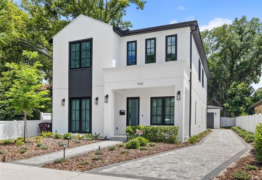 Located just steps from Edgewater Drive, this brand-new modern transitional residence by LUIH Homes places you in the heart of College Park—one of Orlando’s most walkable and character-filled neighborhoods. Zoned for Edgewater High School and College Park Middle School, you’re surrounded by local restaurants, boutique shopping, parks, and community events, all just minutes from your front door.

Unlike most new construction homes, this never-lived-in residence is already fully upgraded and truly move-in ready. Originally purchased as the owners’ intended long-term residence, the home features over $60,000 in thoughtfully selected post-close upgrades designed to enhance both functionality and design. An unexpected out-of-state job relocation now creates a rare opportunity to own a fully upgraded, luxury home without the wait, expense, or hassle of completing post-close projects yourself.

Recent upgrades include app-controlled automated blinds, custom pantry and entry built-ins, designer exterior lighting, CAT-6 wiring, hardwired security cameras, whole-home surge protection, level 2 EV charging outlet, gutter guards, termite prevention system, and a climate-controlled garage with Mitsubishi mini-split. Energy-efficient enhancements include dual-zone HVAC with Google Nest thermostats, solar/privacy window film, and a custom rear awning.

Inside, soaring ceilings, oversized glass sliders, designer lighting, and an open-concept layout create a bright, modern feel throughout. The chef’s kitchen features waterfall quartz countertops, Thermador appliances, custom cabinetry, a walk-in pantry, and a sleek wet bar with wine refrigeration. The spacious primary suite offers a spa-inspired bath with a freestanding soaking tub, oversized walk-in shower, dual vanities, and custom closet system. Additional flex spaces include a downstairs sitting room, upstairs loft, and abundant storage throughout.

Enjoy easy access to Dubsdread Golf Course, The Tap Room at Dubsdread, and the nearby Packing District featuring a food hall, YMCA, and entertainment amenities.