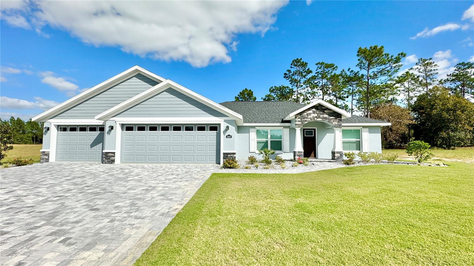 Live in a beautiful gated, top-rated golf course community, located just minutes from Rainbow Springs State Park & the World Equestrian Center! This is a newer home, built in 2022 - only 1 other tenant. 3 Bedrooms, 2 Full Baths, large backyard that backs up to private wooded area with a screened in patio! This home features an open floor plan, granite countertops throughout, tile showers, stainless steel appliances & vinyl flooring throughout, no carpet, making this a very pet friendly home! Large walk-in closet in the spacious master en suite. Enjoy serene sunsets on the screened in patio. Bring your golf cart and play golf on our top-rated golf course, #3 in Florida and #8 in the US! This is a secure gated community. This price reflects 1 year lease unfurnished. Water & electric are only utilities to be paid by the tenant. HOA, Lawn Care & Pest Control, TV, Internet & Trash Service are all INCLUDED in monthly rental rate. Short term lease available furnished only $4,500/month including utilities (Off-Season April-December) & $7,500/month including utilities (In Season Jan-March).