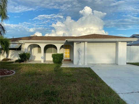 Photo of 8948 Saint Regis Lane, Port Richey, FL 34668 (MLS # TB8431427) Photo of 8948 Saint Regis Lane, Port Richey, FL 34668 (MLS # TB8431427)