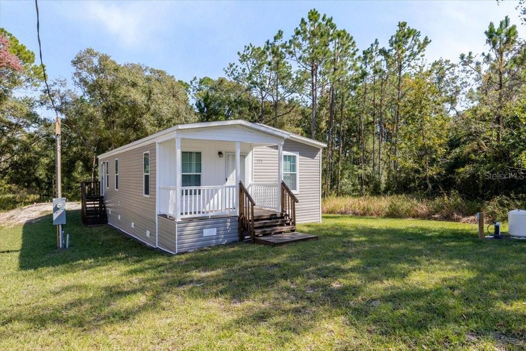 Photo of 326 Smith Road, Polk City, FL 33868 (MLS # O6361964)