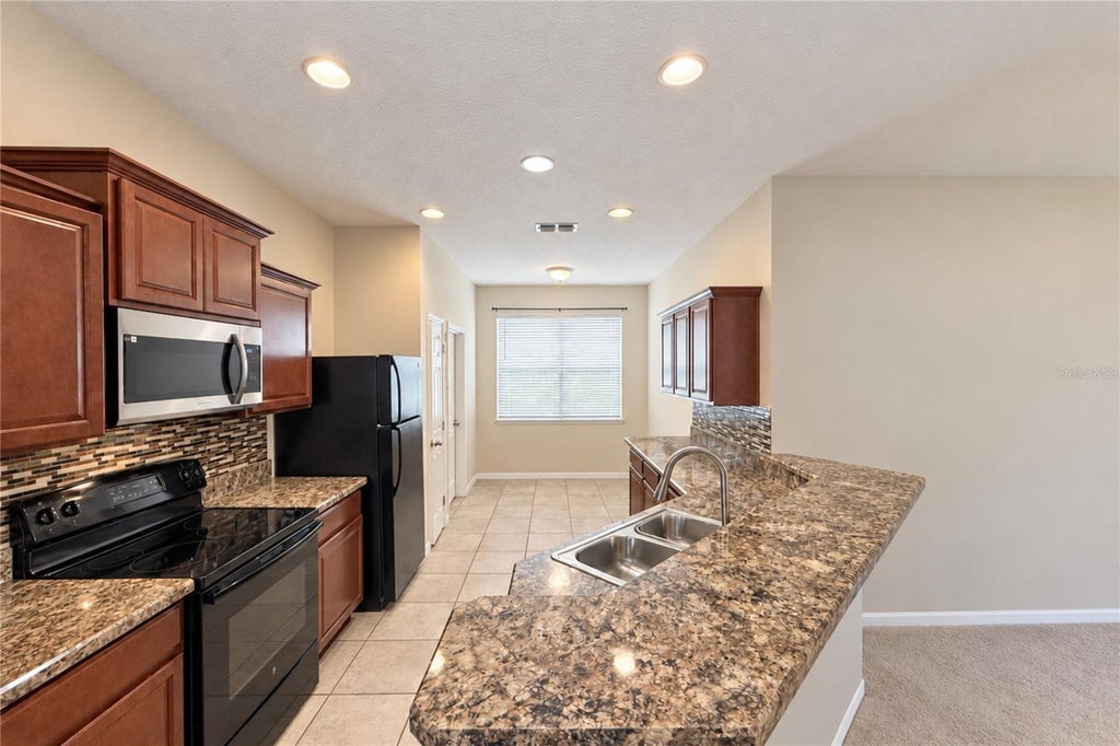 Photo of 152 Highland Meadow Ave, Davenport, FL 33837 (MLS # S5156796)