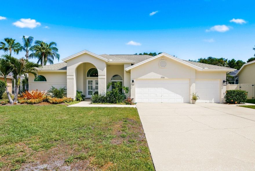 Absolutely stunning and move in ready home located in the highly sought after Pipers Meadow! This exceptional residence offers 4 bedrooms, 3 beautifully renovated bathrooms, and a spacious 3 car garage. From the moment you arrive, you will appreciate the gorgeous curb appeal featuring attractive pavers, a modern hurricane impact rated front door, and hurricane impact windows and sliding doors throughout. Inside, the open and spacious 3 way split floor plan is perfect for everyday living and entertaining. The open living and dining area flows easily into the spacious kitchen and family room creating the ideal layout for gatherings and daily living. Luxury vinyl plank flooring flows throughout the home along with crown molding, plantation shutters, and custom wireless blinds in the family room and bedroom. The updated kitchen is a chef’s dream showcasing quality cabinetry, quartz countertops, newer appliances, induction oven, and Bosch dishwasher. The private rear suite with its own bathroom is ideal for guests, multigenerational living, or an in law suite. Step outside to your tropical oasis featuring a salt water Pebble Tec pool, brick paver lanai, and plenty of space to relax and entertain while enjoying the privacy of the rear of the property overlooking a dry retention pond with no rear neighbors. Additional upgrades within the last 5 years include water softener, flooring, fans and light fixtures, exterior paint, and front door. Other notable features include Gerber toilets in all bathrooms, Trane HVAC 2018, and roof 2010. Pipers Meadow is a hidden gem community offering wonderful social activities including block parties, holiday events, bunco, and a book club. Conveniently located just minutes from Honeymoon Island State Park, the Pinellas Trail, shopping, dining, and top rated schools including Palm Harbor University High School and Palm Harbor Middle School. This is truly an opportunity too good to miss!