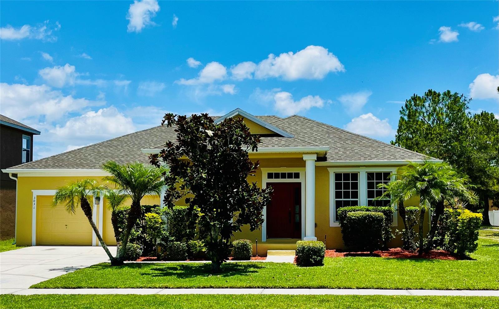 Stunning 4-bedroom, 2-bathroom home has been meticulously crafting the ultimate in elegance and comfort. This home promises years of worry-free enjoyment. As you approach, you're greeted by a welcoming front covered porch, perfect for enjoying your morning coffee or greeting neighbors passing by, looking over the beautiful landscape. When you step inside you will be captivated by the architectural marvels that adorn every corner, from the rounded archways to the elegant crown molding. Tall ceilings and ceiling fans in every bedroom create an atmosphere of airy comfort and relaxation, lending an air of sophistication to every corner and highlighting the beautiful craftsmanship throughout. In the heart of the home, the kitchen is a chef's delight, featuring elongated countertops, surrounded by tall mahogany cabinets, and equipped with a complete appliance package. A convenient pantry and breakfast bar overlooking the family room makes entertaining a breeze or cozy family time in the eat in area of the kitchen. For more formal gatherings, retreat to the elegant formal living room, perfect for hosting guests or enjoying quiet moments of relaxation. The master suite is a luxurious sanctuary, offering an ensuite bathroom complete with double sinks, a garden tub, stand-up shower, and a huge walk-in closet. A private commode closet adds an extra touch of convenience and privacy. Outside, the back covered porch offers views of the playground and walking trail, creating the perfect backdrop for outdoor gatherings or moments of peaceful reflection. the community offers an array of amenities to enrich your lifestyle. From a sparkling pool and splash pad to a state-of-the-art fitness center, tennis courts and scenic walking trails, there's something for everyone to enjoy. Take in breathtaking views of Lake Toho from the picnic areas and walking trails, creating unforgettable memories right in your own backyard. Don't let this opportunity slip away! Schedule your showing today and make your dream lifestyle a reality in this exceptional home, where luxury meets convenience in the most desirable of settings.