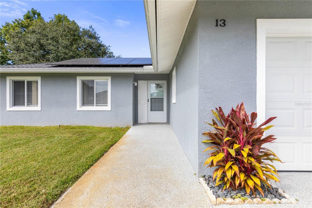 Photo of 13 Belleaire Drive, Palm Coast, FL 32137 (MLS # FC321827)