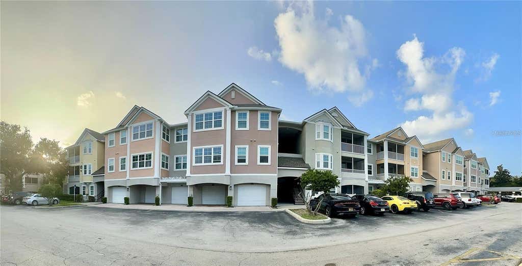 Photo of 6413 Astor Village Avenue #201, Orlando, FL 32835 (MLS # O6434194)