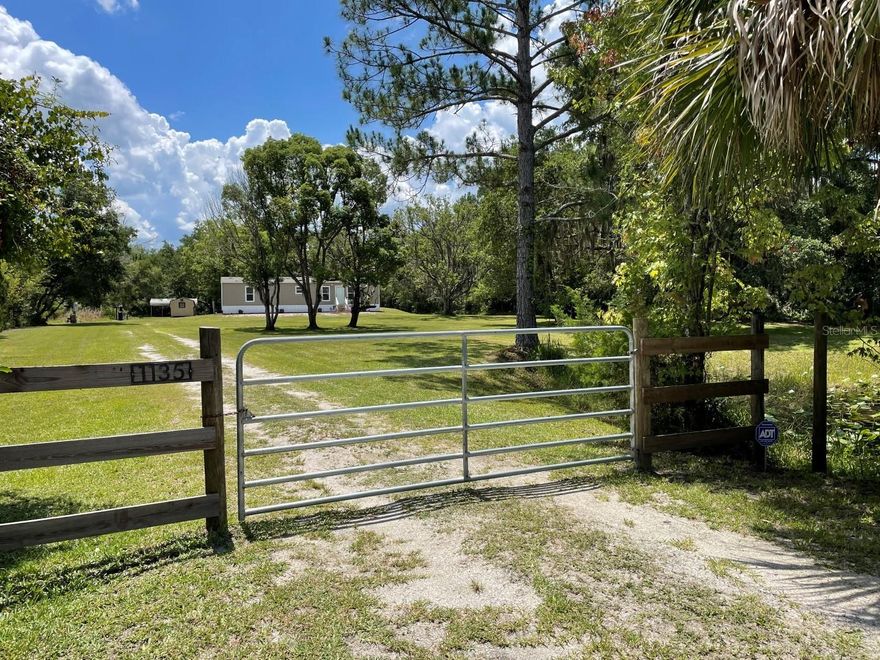 If you are looking to escape to the country in the beautiful New Smyrna Beach - Samsula area, look no further! This newer 2BR/2BA manufactured home (2018 year built) is perfect for those looking for their own piece of rural paradise near Lake Ashby! Situated on 1.38 mostly cleared acres, this property offers a park-like setting with abundant wildlife and different tree species throughout and also has a small pond. Mostly fenced with gated entrance. This well kept, meticulously maintained home offers neutral colors inside with plenty of natural light. Septic is newer (2018); as is the well pump and water softener system. Also included in sale is a storage shed and two-vehicle carport. Plenty of room for those looking to construct a detached garage or pole barn for room for their toys, RV, ATVs, tools, and more!!! Just a few minutes (walking distance) to the Lake Ashby Boat Ramp, fishing, and Lake Ashby Park. Perfect for snowbirds who want to escape the hustle and bustle and cold weather up north to enjoy all the Florida lifestyle has to offer. Zoned for Pride Elementary, Creekside Middle School, and New Smyrna Beach High School. Close to New Smyrna Beach shopping, restaurants, beach, Port Orange, Daytona Beach, Deltona Walmart and the Sanford Orlando Airport, and a short commute to all Orlando attractions like Disney and Universal Studios. Ideal for those who commute to work... I-95, I-4, 417, etc are all a short drive. Buyer to verify all information, measurements, etc.